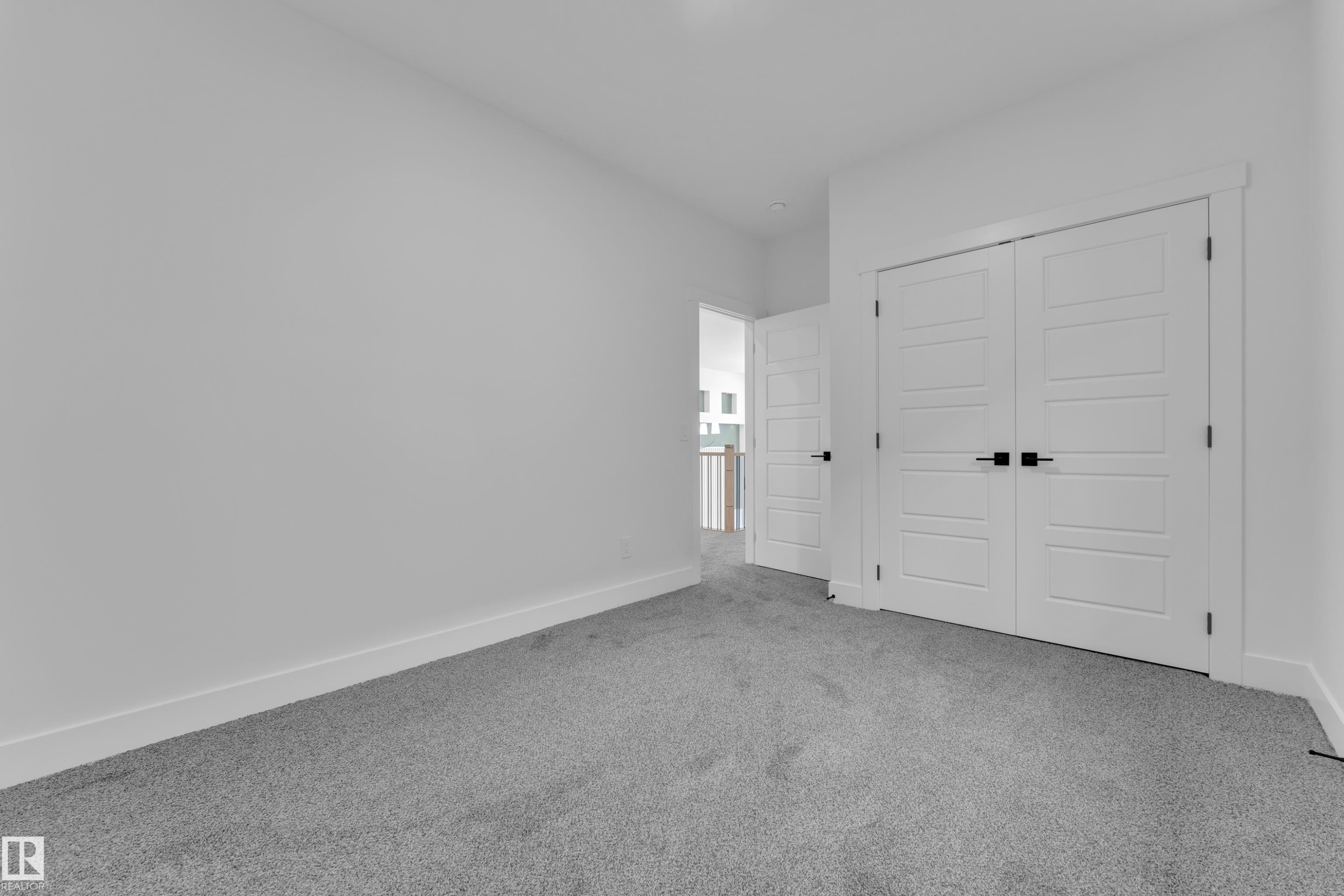 Unfurnished bedroom with carpet flooring and a closet - 228 Linden Loop, Leduc, AB - Indoor Photo Showing Other Room