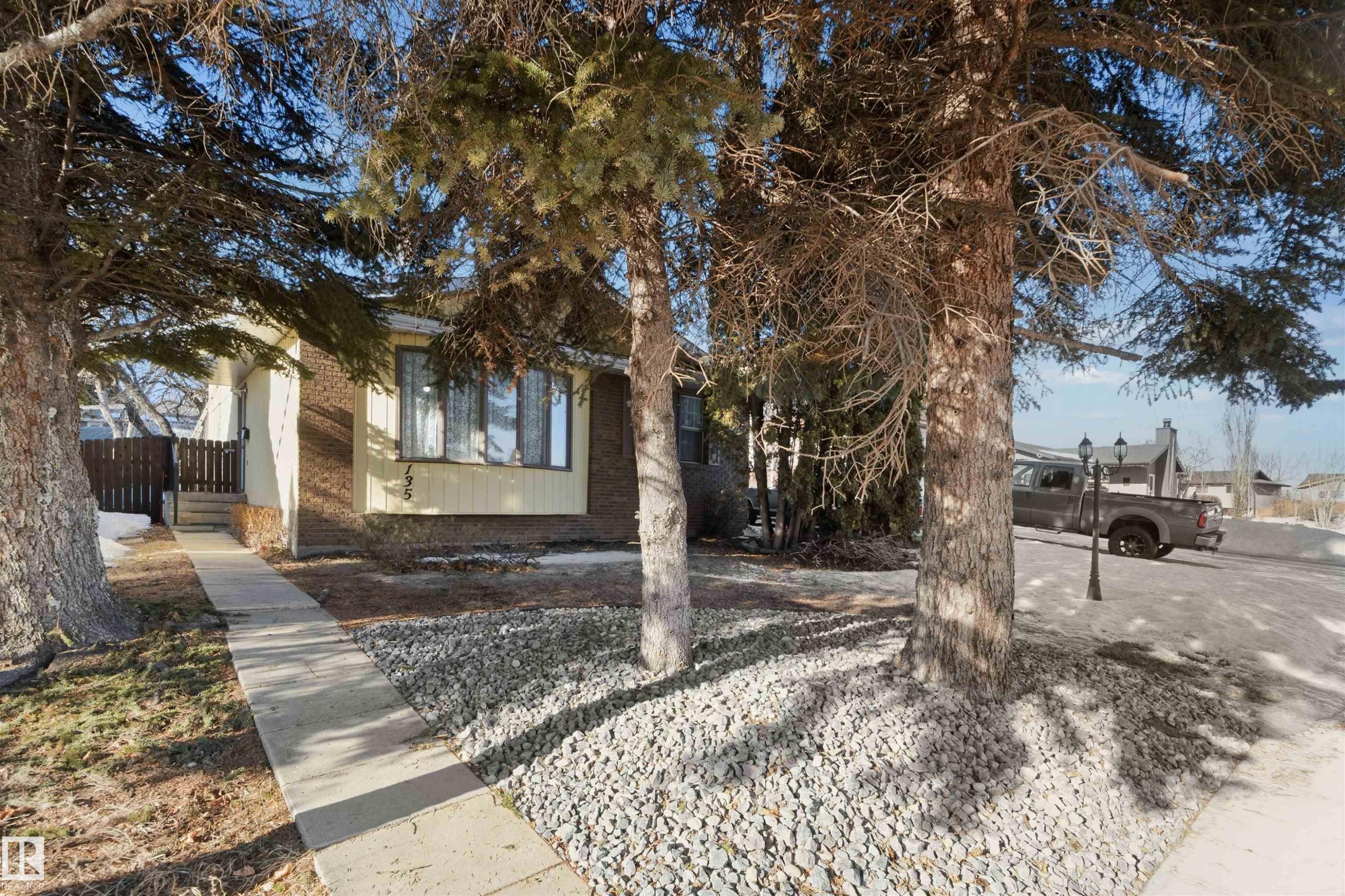 Obstructed view of property featuring brick siding - 135 Humberstone Road, Edmonton, AB - Outdoor