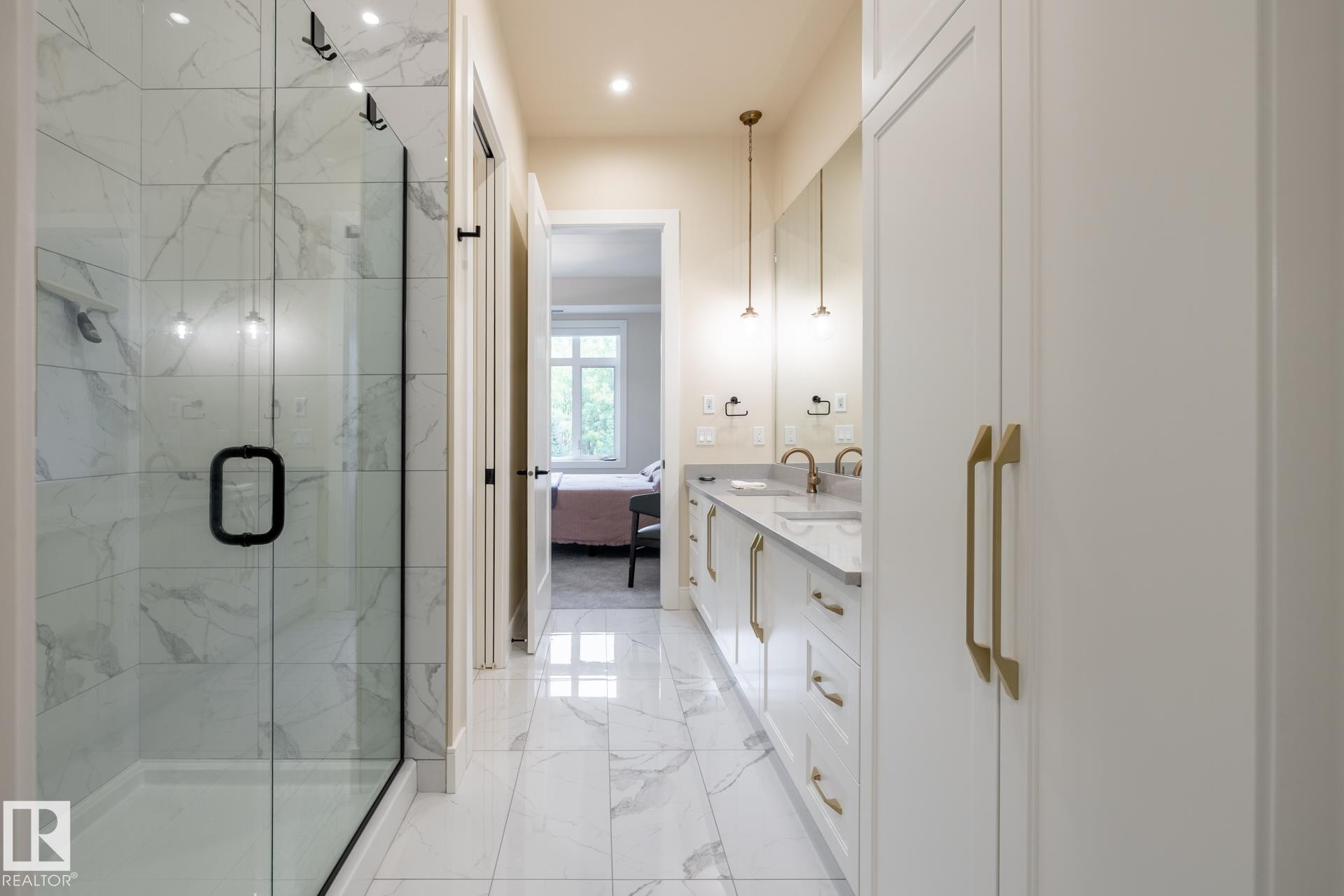 Bathroom featuring a marble finish shower, light marble finish flooring, ensuite bath, double vanity, and recessed lighting - 112 7471 May Common, Edmonton, AB - Indoor Photo Showing Bathroom