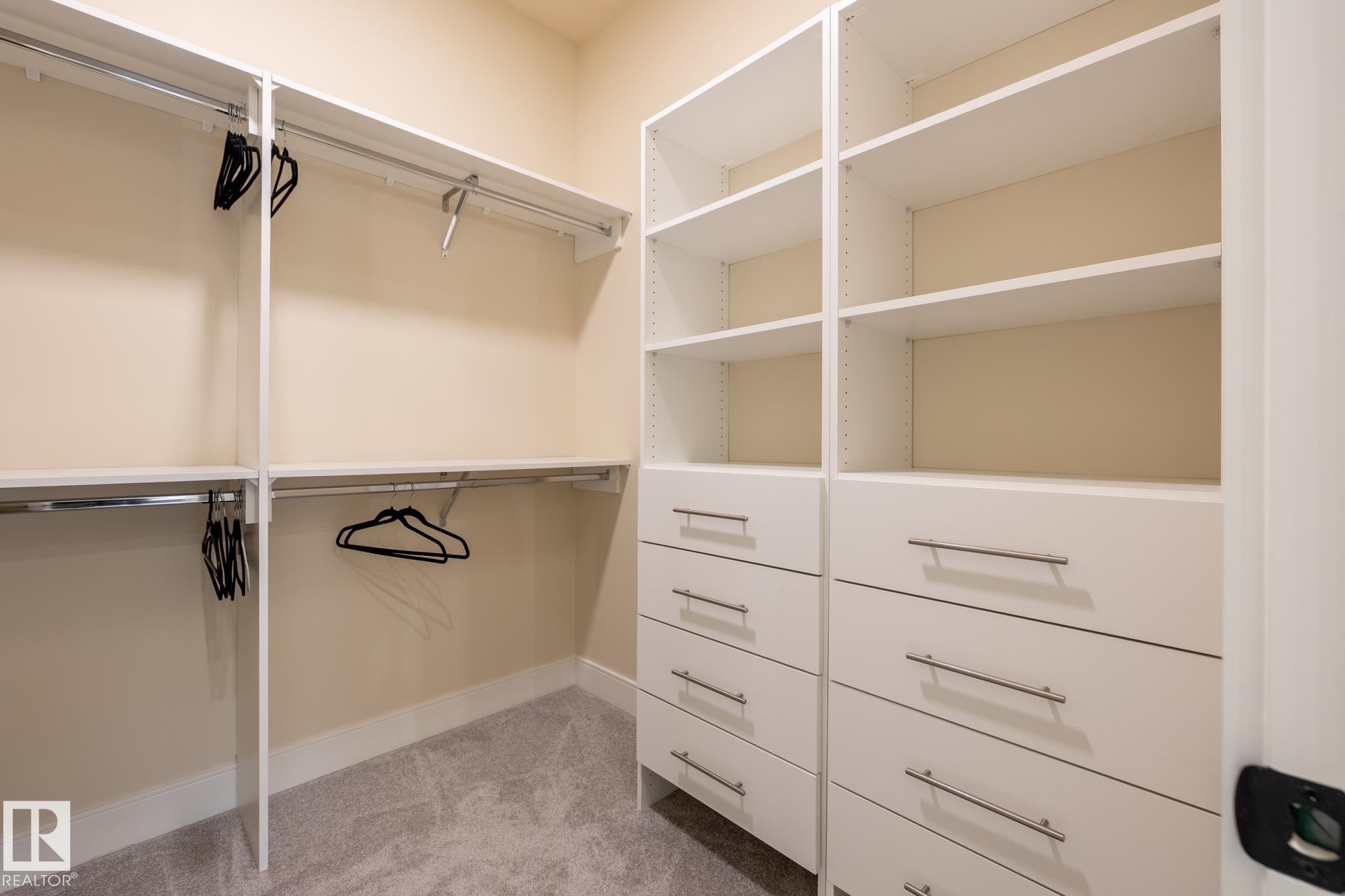 Walk in closet with light colored carpet - 112 7471 May Common, Edmonton, AB - Indoor With Storage