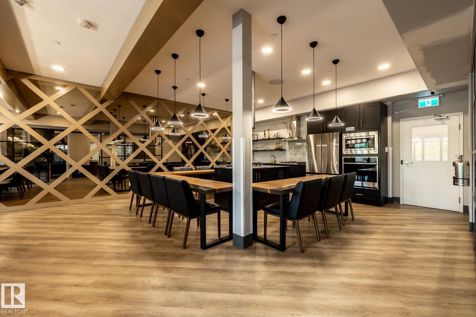 Dining space featuring light wood-style floors and recessed lighting - 112 7471 May Common, Edmonton, AB - Indoor Photo Showing Dining Room
