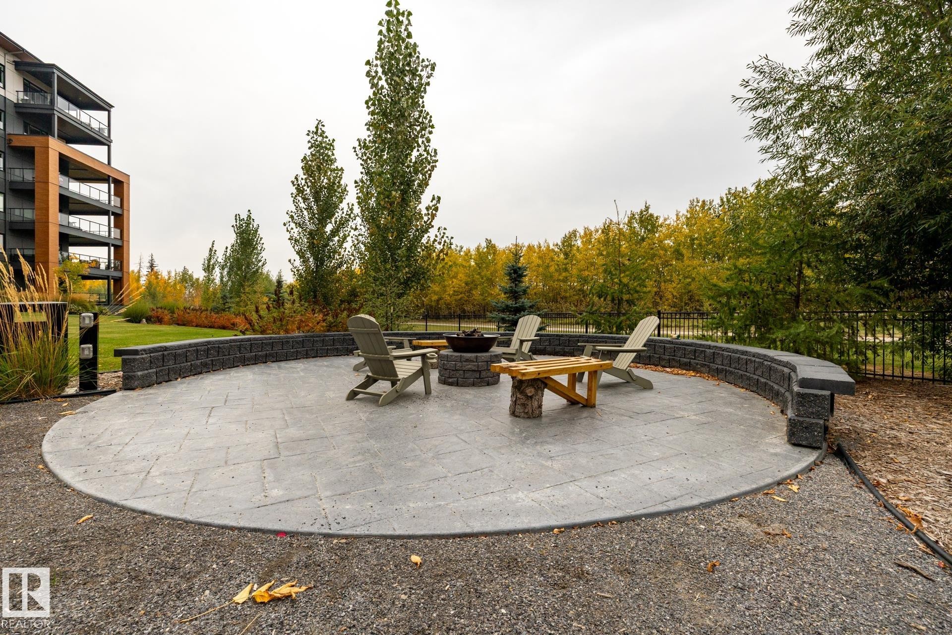 View of patio featuring an outdoor fire pit - 112 7471 May Common, Edmonton, AB - Outdoor