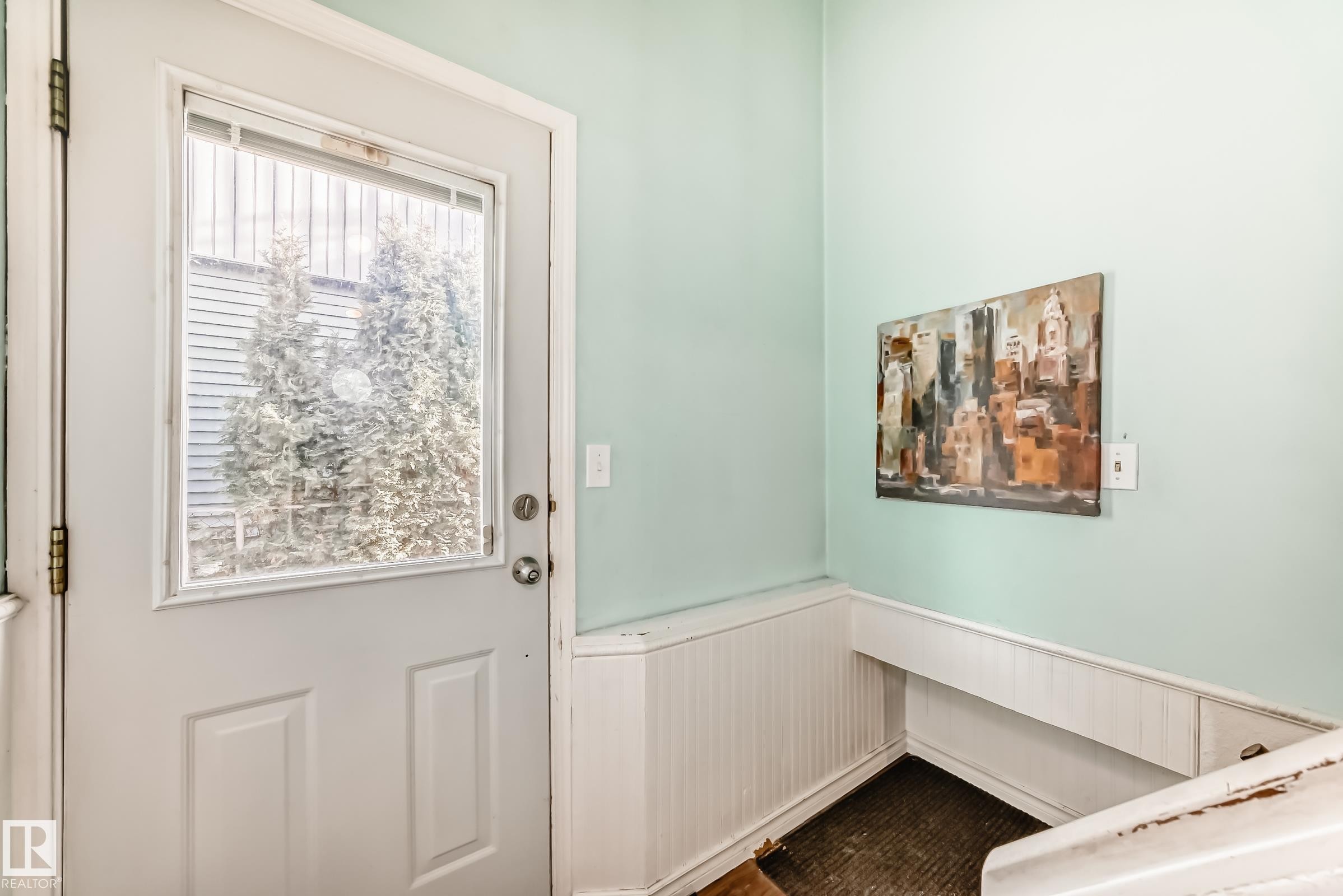 Doorway with a wainscoted wall - 8639 64 Avenue Nw, Edmonton, AB - Indoor Photo Showing Other Room