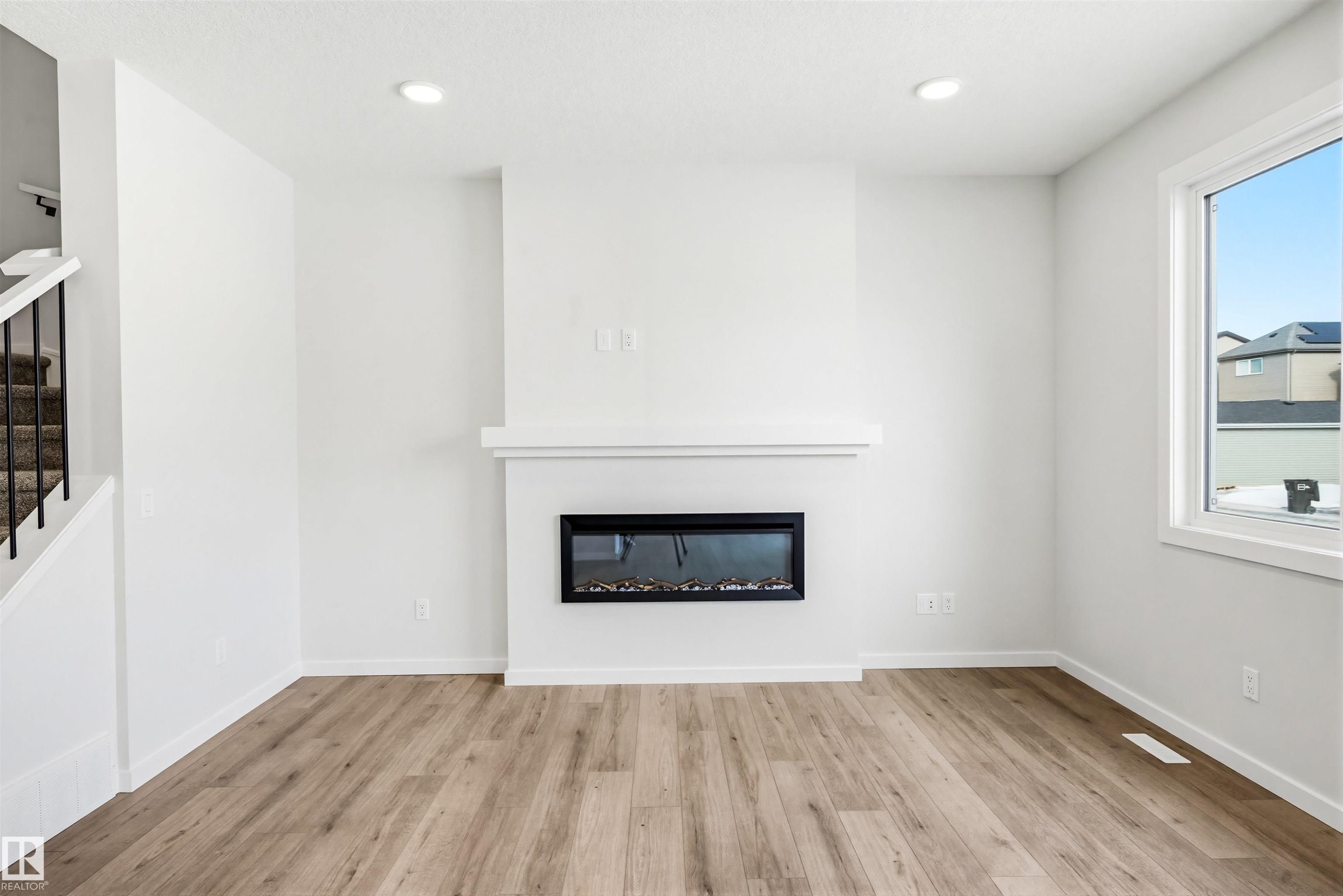 17351 3 Street, Edmonton, AB - Indoor Photo Showing Living Room With Fireplace