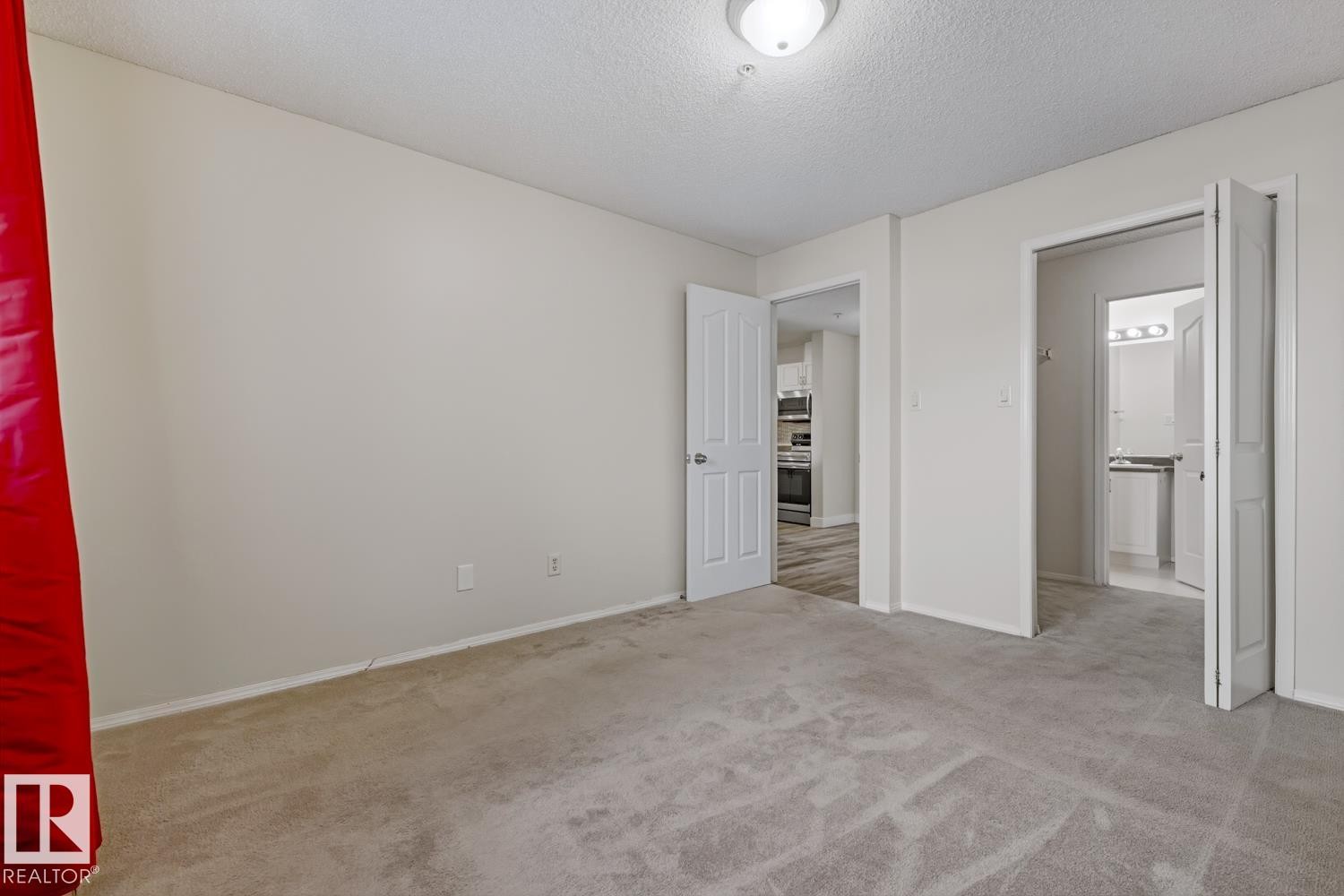 Room with light-colored walls and grey carpet flooring - 237 17447 98A Avenue, Edmonton, AB - Indoor Photo Showing Other Room