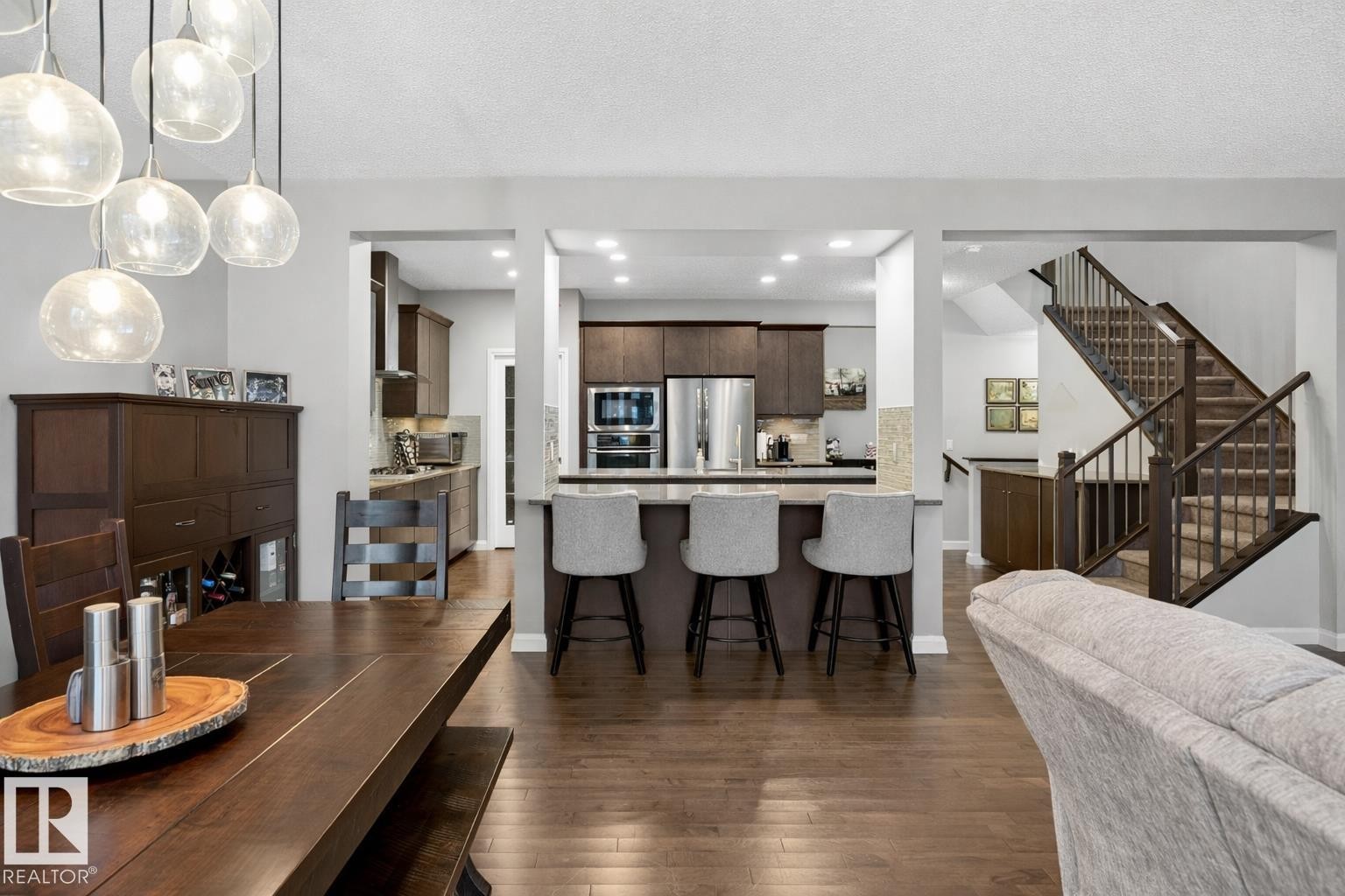 This property features dark hardwood floors throughout the living spaces - 17838 60A Street, Edmonton, AB - Indoor