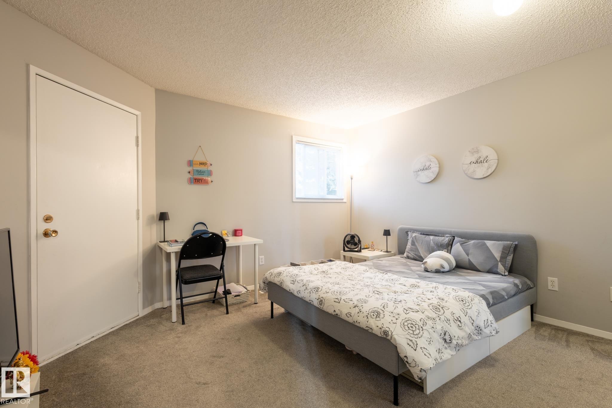 Bedroom featuring a textured ceiling and carpet flooring - 3530 42 Street, Edmonton, AB - Indoor Photo Showing Bedroom