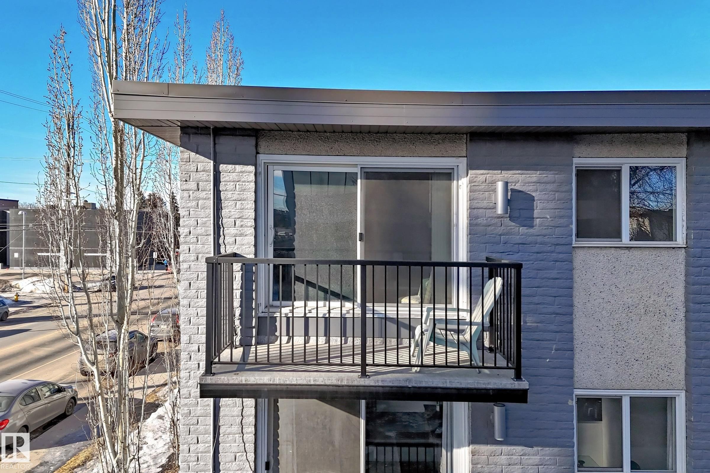 Back of property with a balcony and stone siding - 302 10606 123 Street, Edmonton, AB - Outdoor