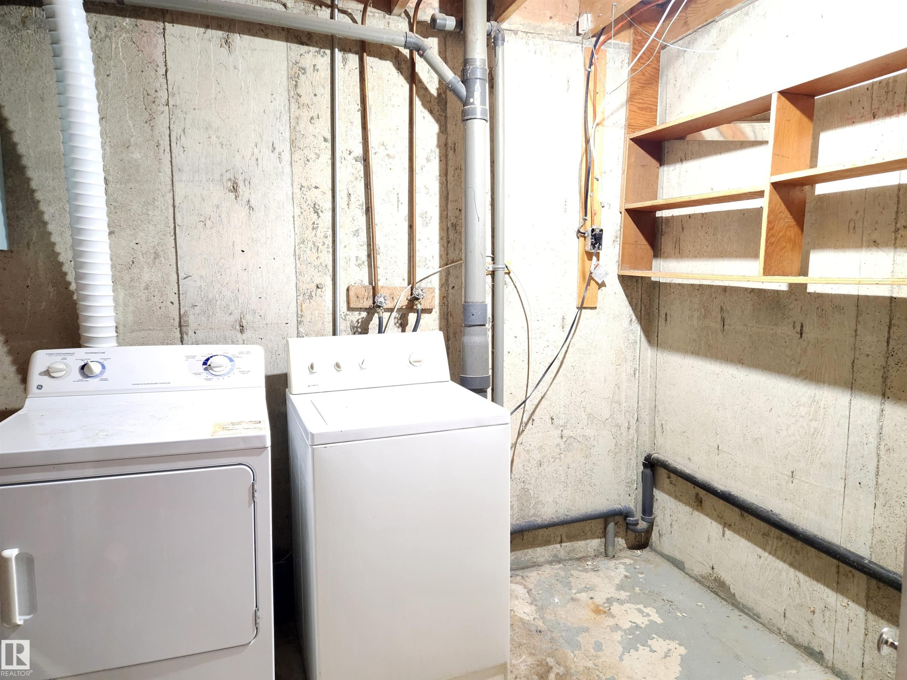 Laundry area with concrete flooring and washer and dryer - 6 14320 80 Street, Edmonton, AB - Indoor Photo Showing Laundry Room