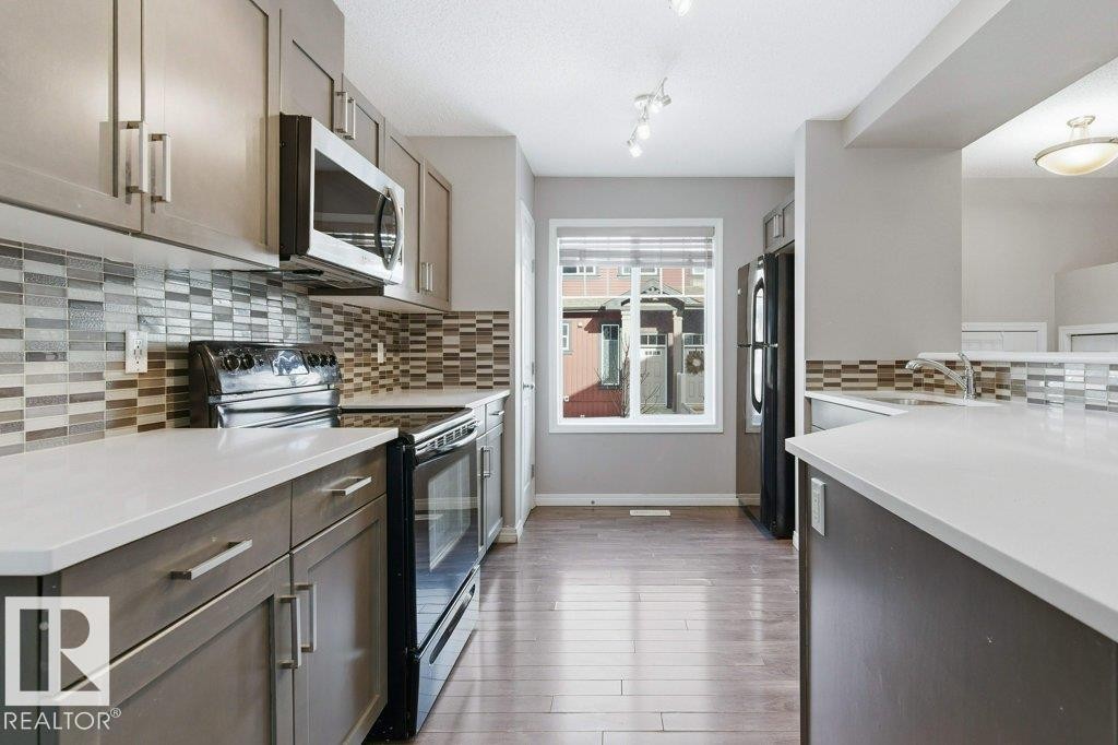 74 3305 Orchards Li, Edmonton, AB - Indoor Photo Showing Kitchen With Upgraded Kitchen