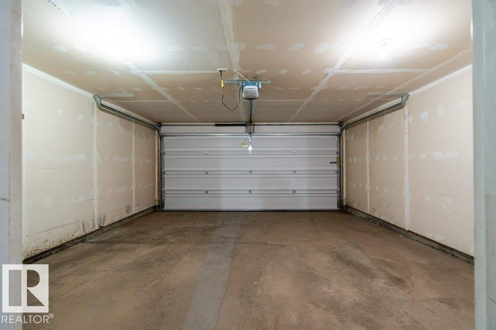 74 3305 Orchards Li, Edmonton, AB - Indoor Photo Showing Garage