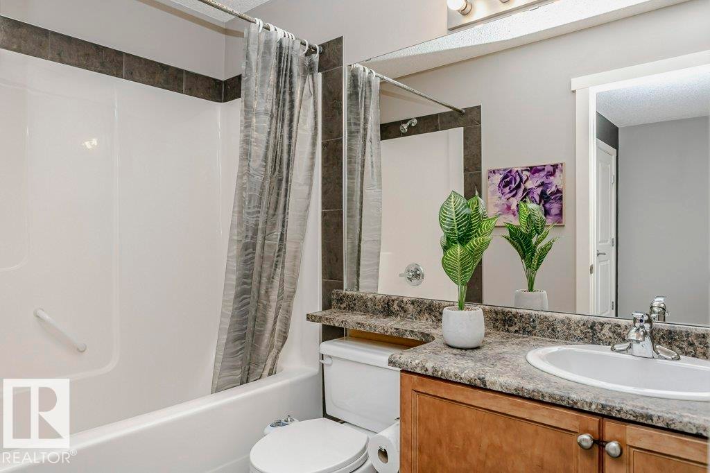 Full bathroom featuring vanity and shower / tub combo with curtain - 1381 Rutherford Road, Edmonton, AB - Indoor Photo Showing Bathroom
