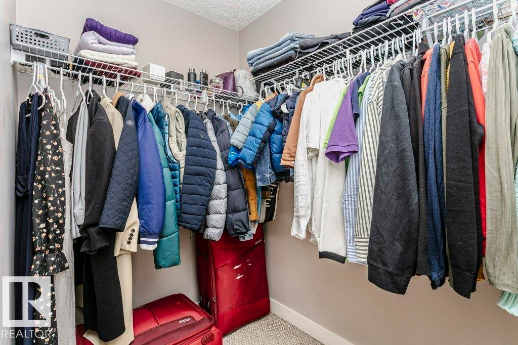 View of walk in closet - 1381 Rutherford Road, Edmonton, AB - Indoor With Storage