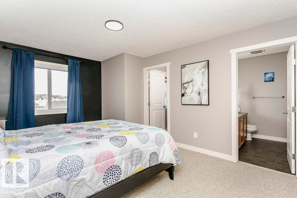 Bedroom featuring carpet and a textured ceiling - 1381 Rutherford Road, Edmonton, AB - Indoor Photo Showing Bedroom