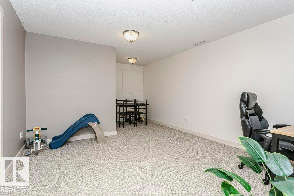 Carpeted office space featuring baseboards - 1381 Rutherford Road, Edmonton, AB - Indoor Photo Showing Office