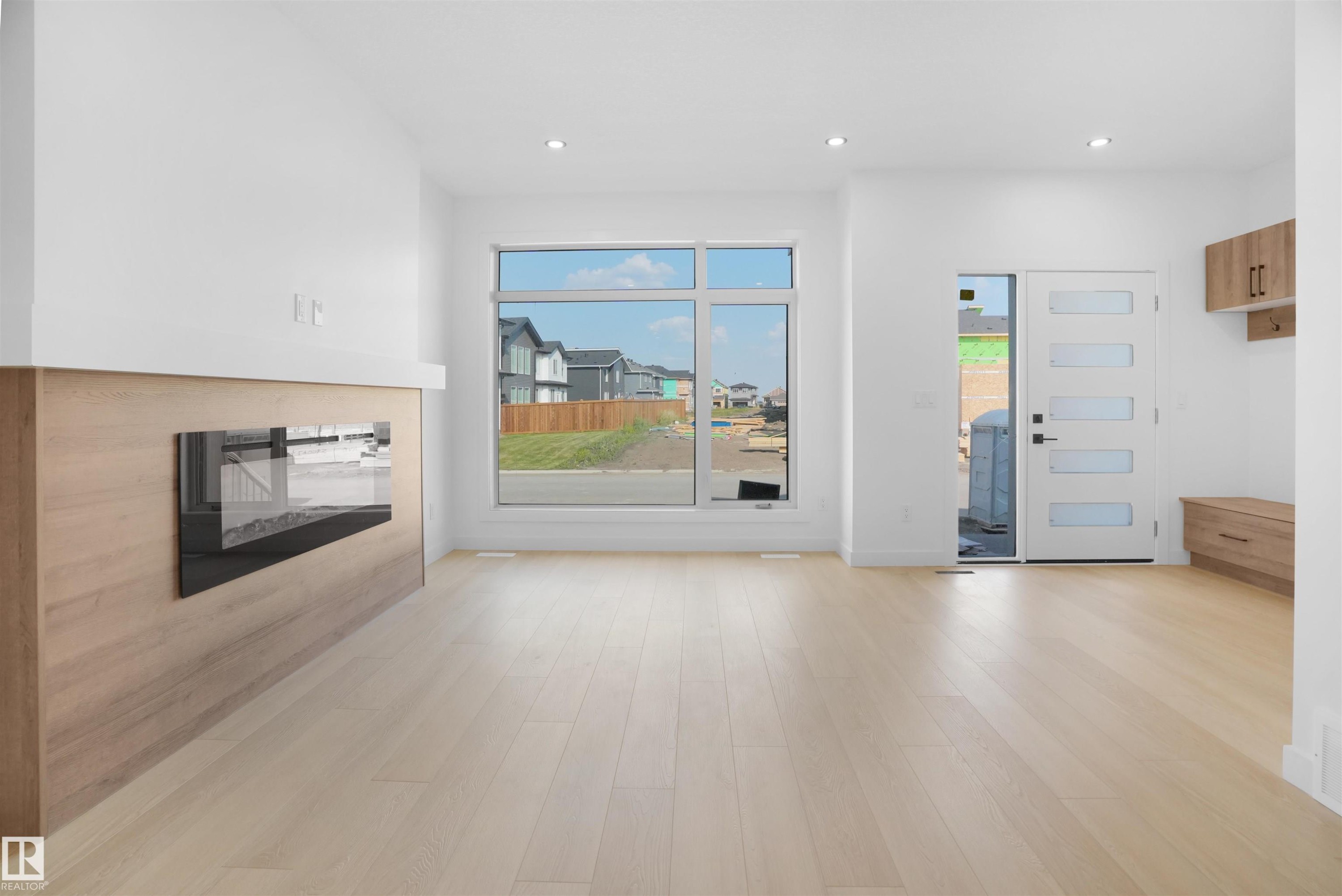 84 Blackbird Bend, Fort Saskatchewan, AB - Indoor Photo Showing Other Room With Fireplace