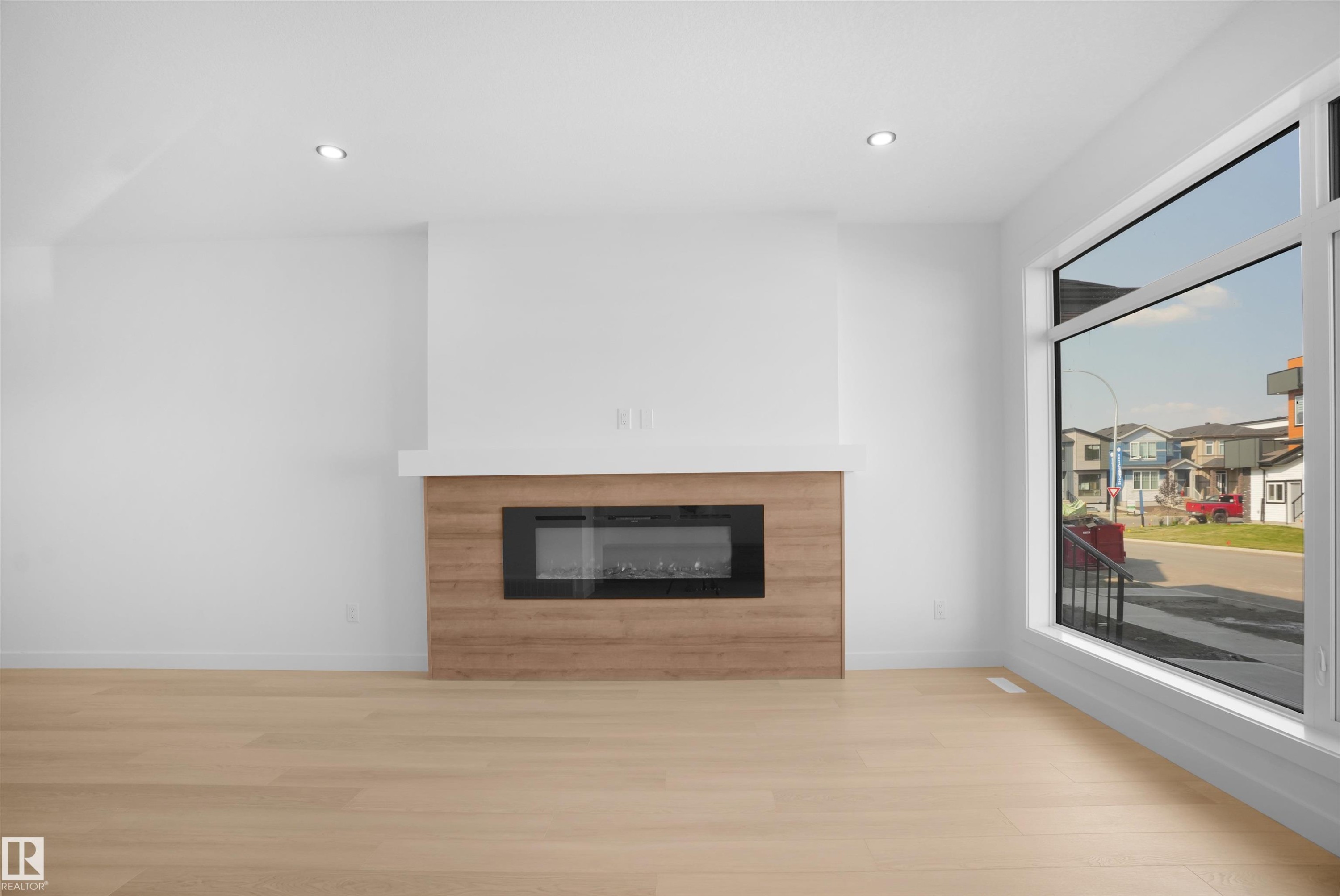 84 Blackbird Bend, Fort Saskatchewan, AB - Indoor Photo Showing Living Room With Fireplace