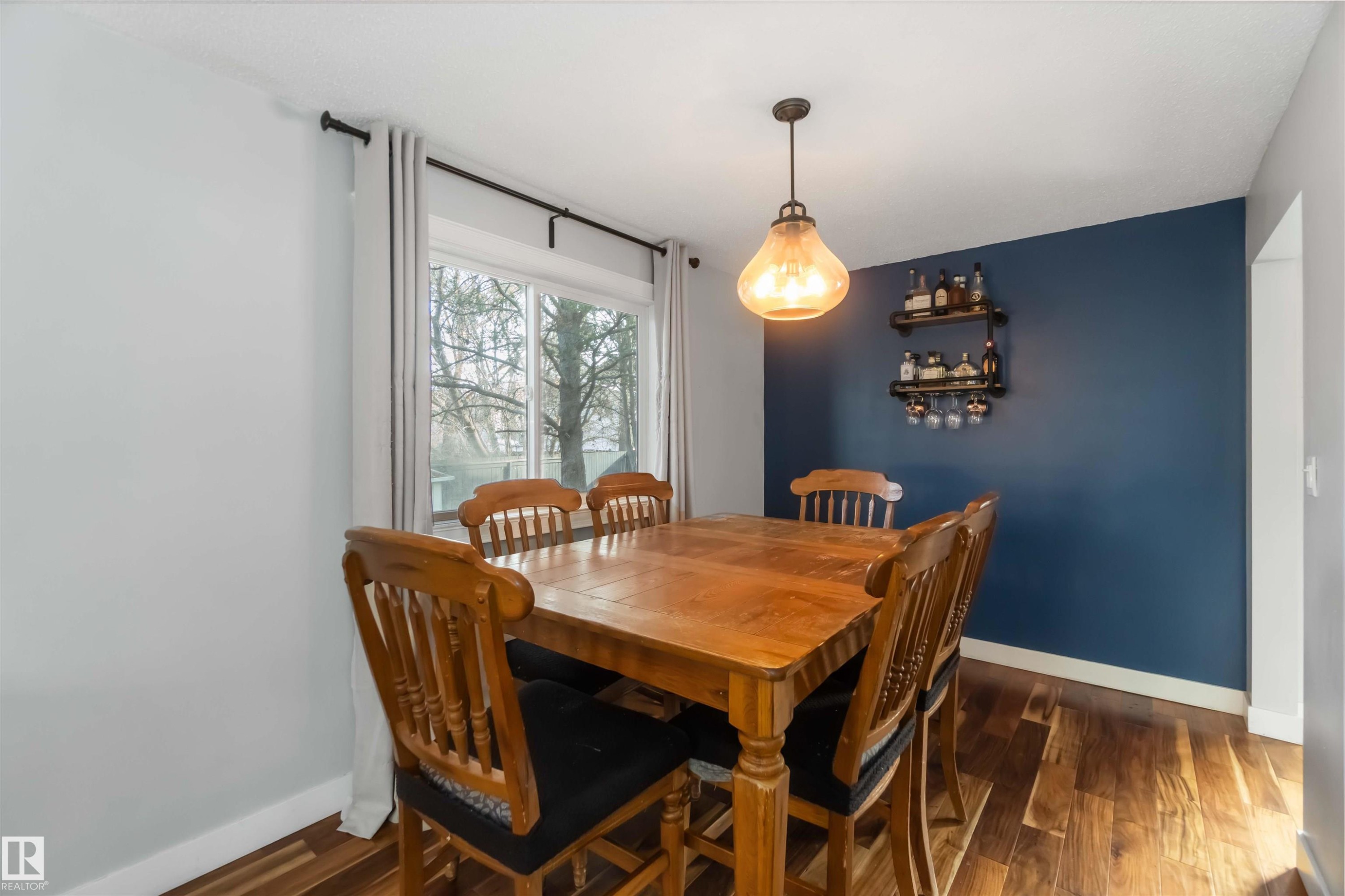 Dining room with dark wood-type flooring and baseboards - 6 Garraway Pl, St. Albert, AB - Indoor Photo Showing Dining Room