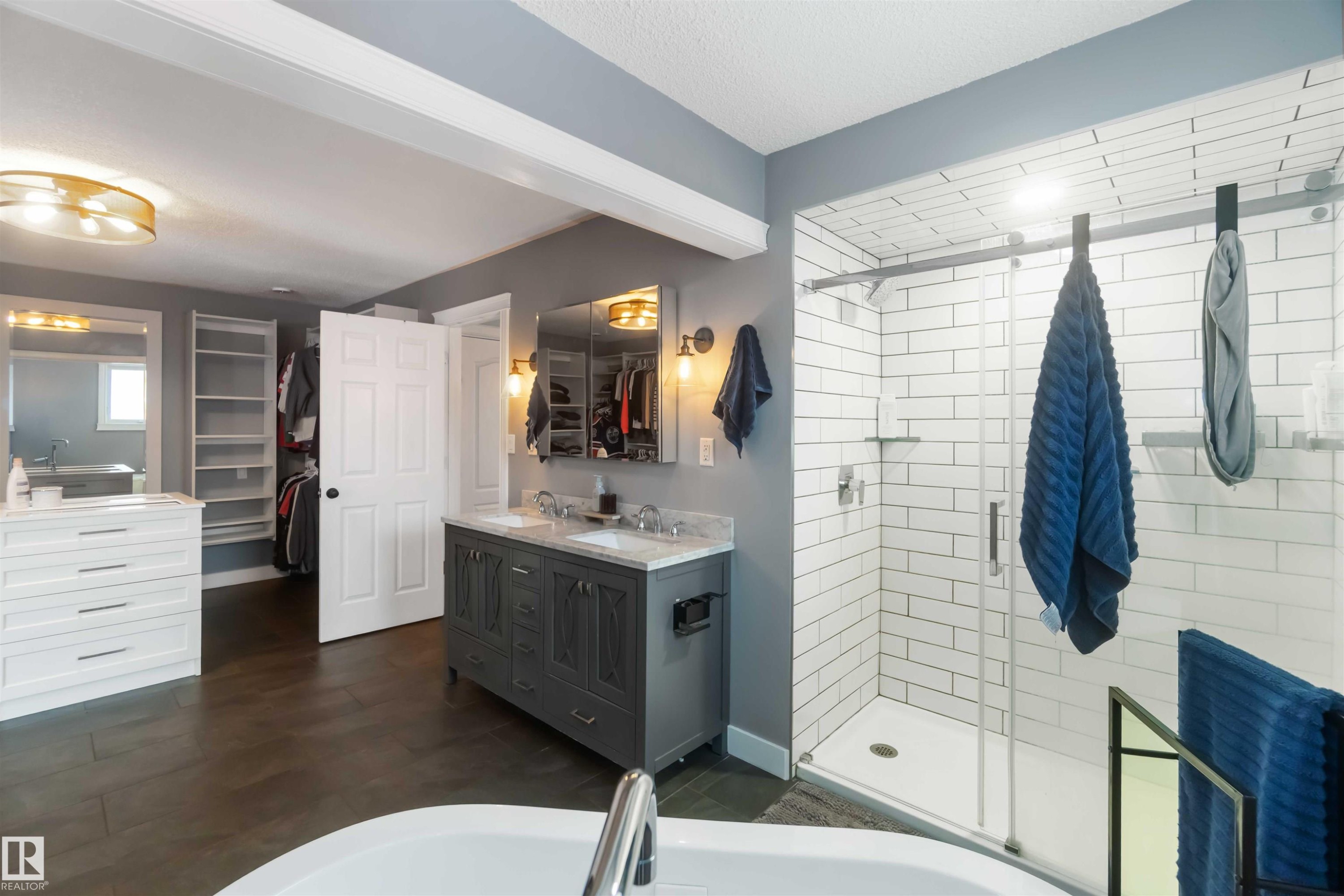 Bathroom with double vanity, a walk in closet, a stall shower, and a bath - 6 Garraway Pl, St. Albert, AB - Indoor Photo Showing Bathroom