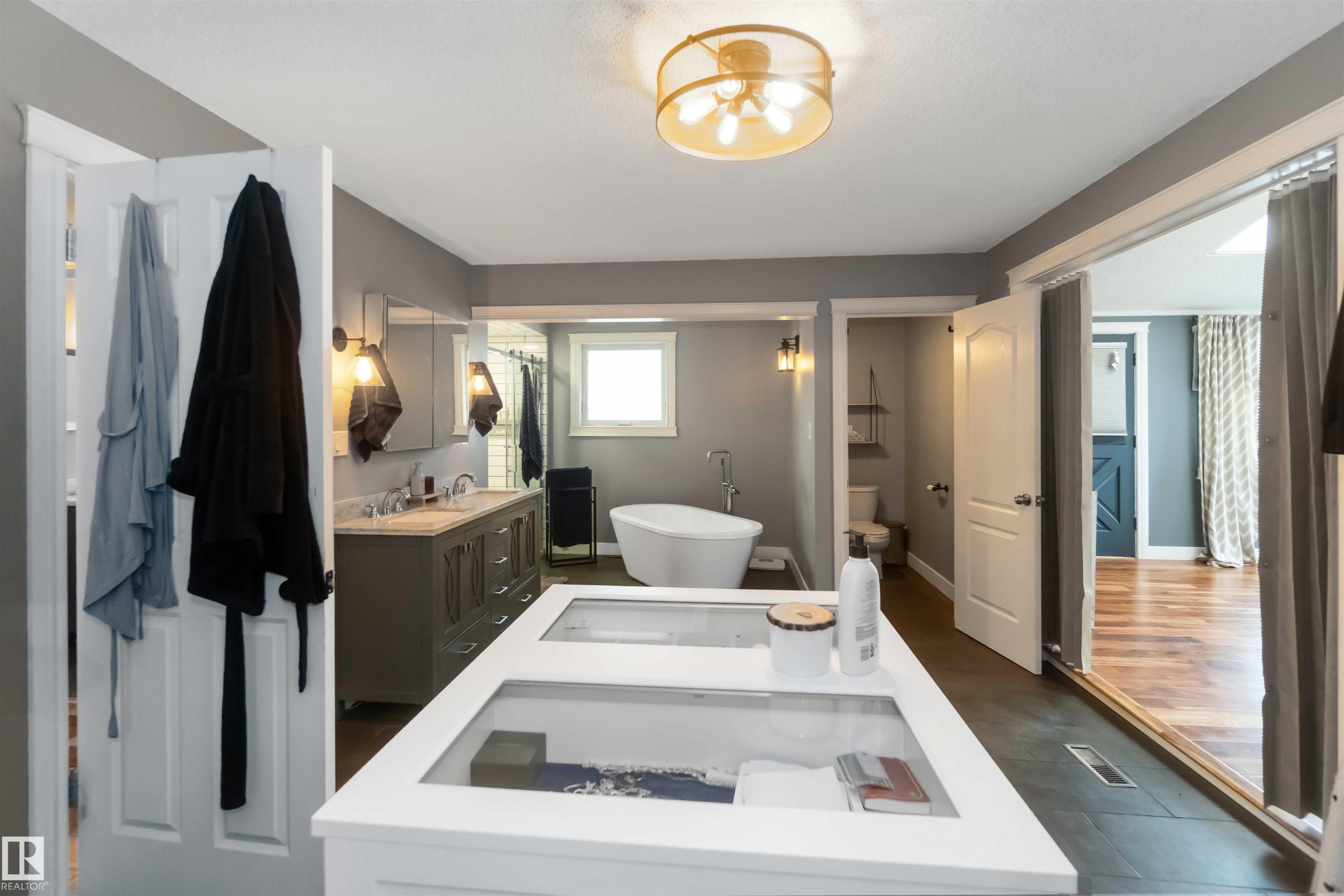 Full bathroom with a soaking tub and vanity - 6 Garraway Pl, St. Albert, AB - Indoor Photo Showing Other Room