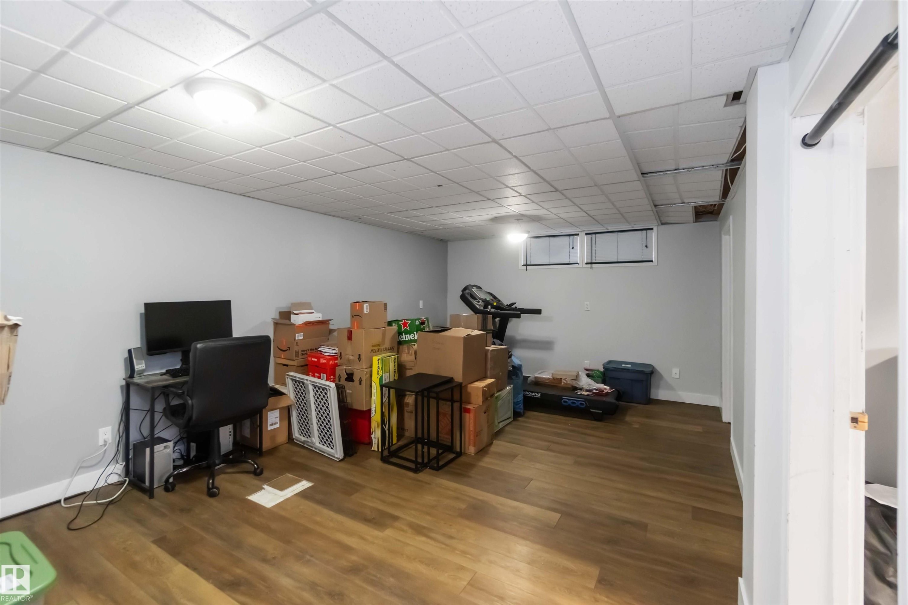 Home office featuring wood finished floors and a paneled ceiling - 6 Garraway Pl, St. Albert, AB - Indoor