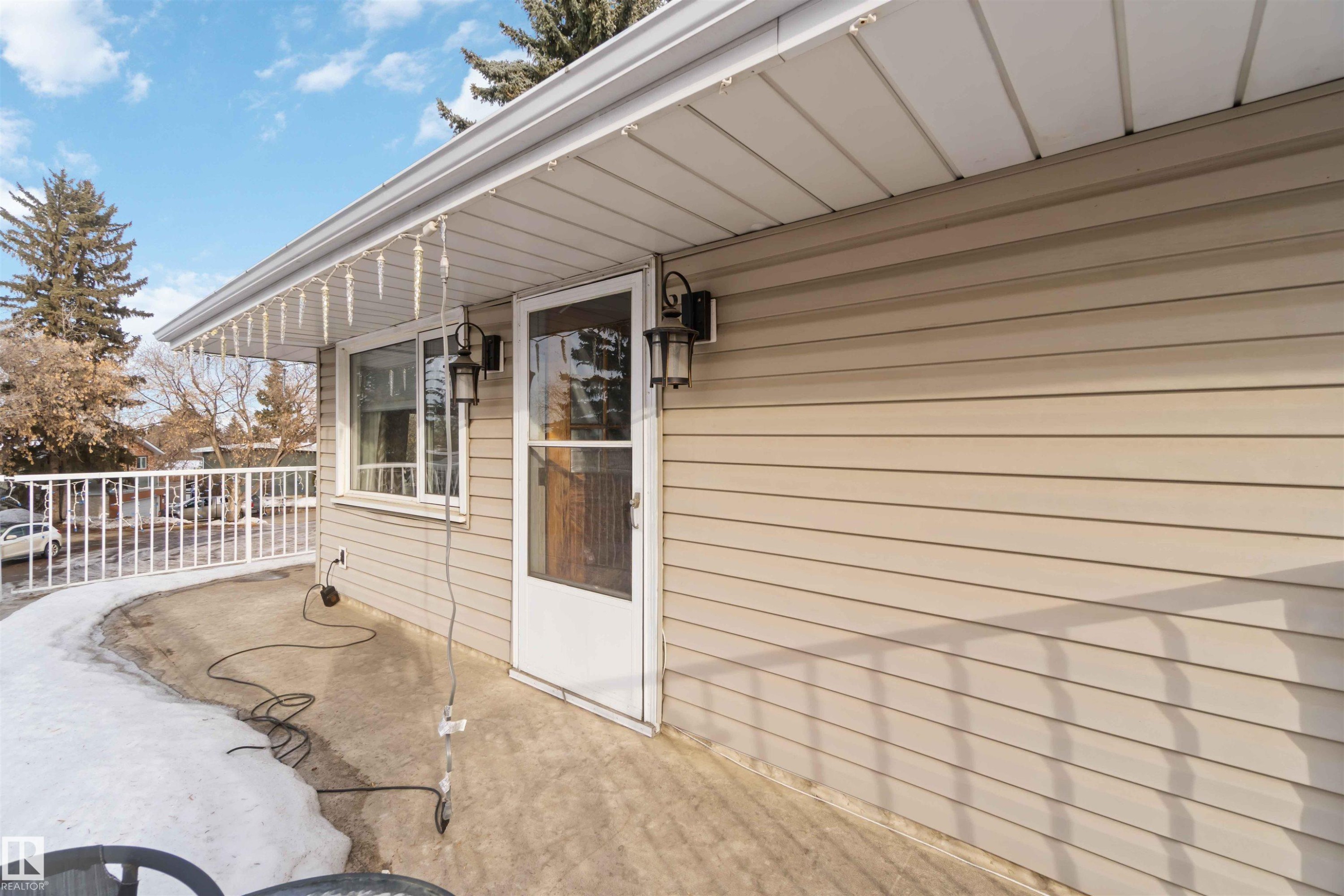View of exterior entry with a patio - 6 Garraway Pl, St. Albert, AB - Outdoor With Exterior