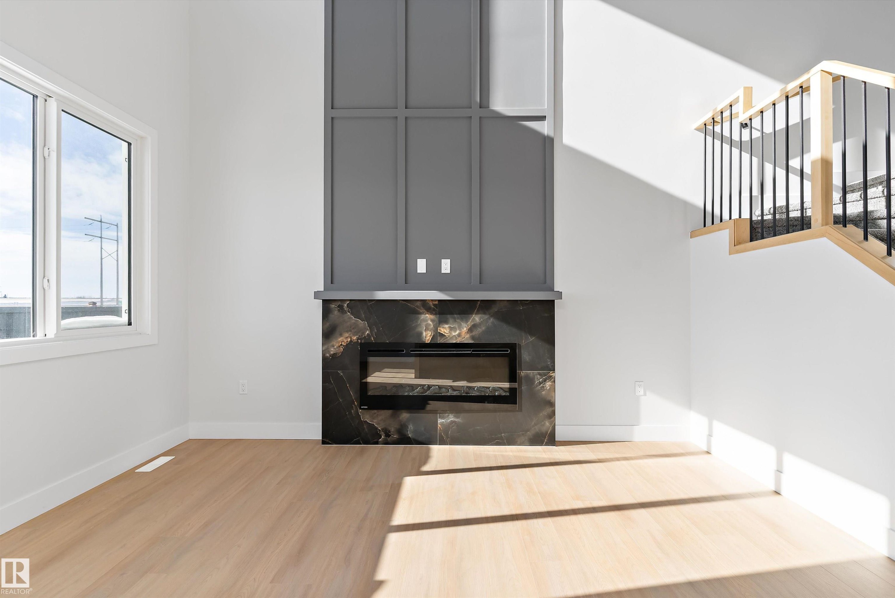 34 Astoria Place, Devon, AB - Indoor Photo Showing Living Room With Fireplace