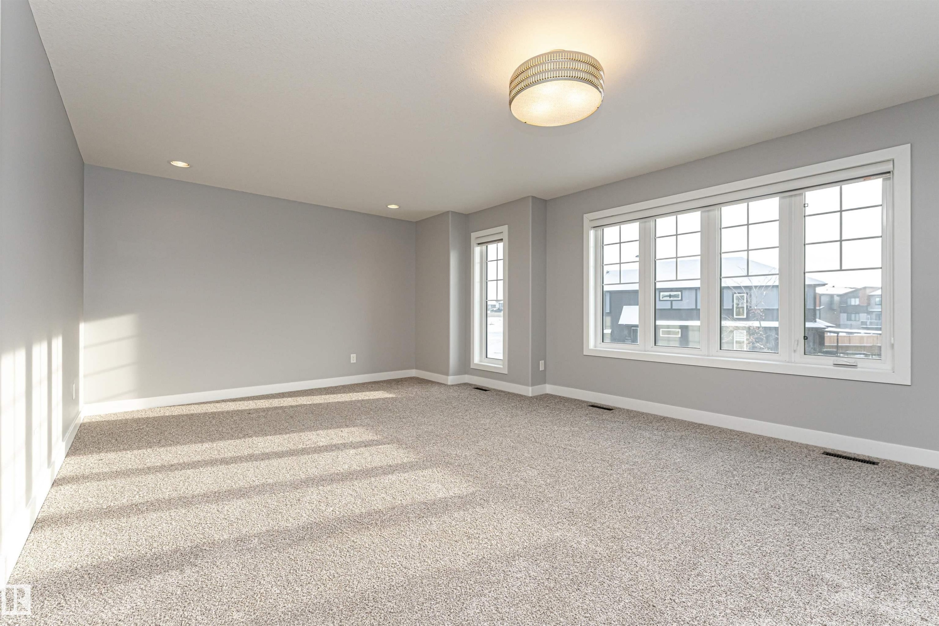 Spare room with light colored carpet and recessed lighting - 3611 Keswick Boulevard, Edmonton, AB - Indoor Photo Showing Other Room