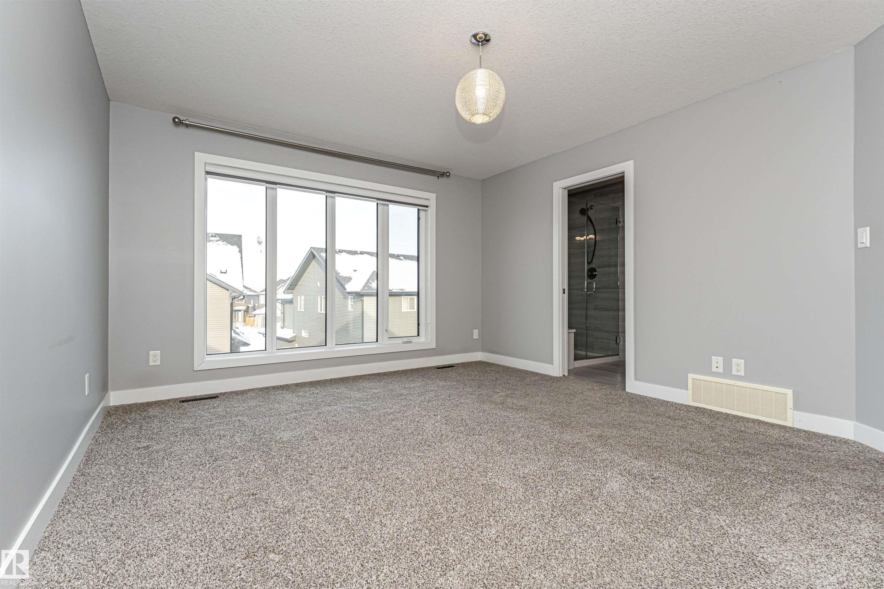 Unfurnished room featuring light carpet and a textured ceiling - 3611 Keswick Boulevard, Edmonton, AB - Indoor Photo Showing Other Room