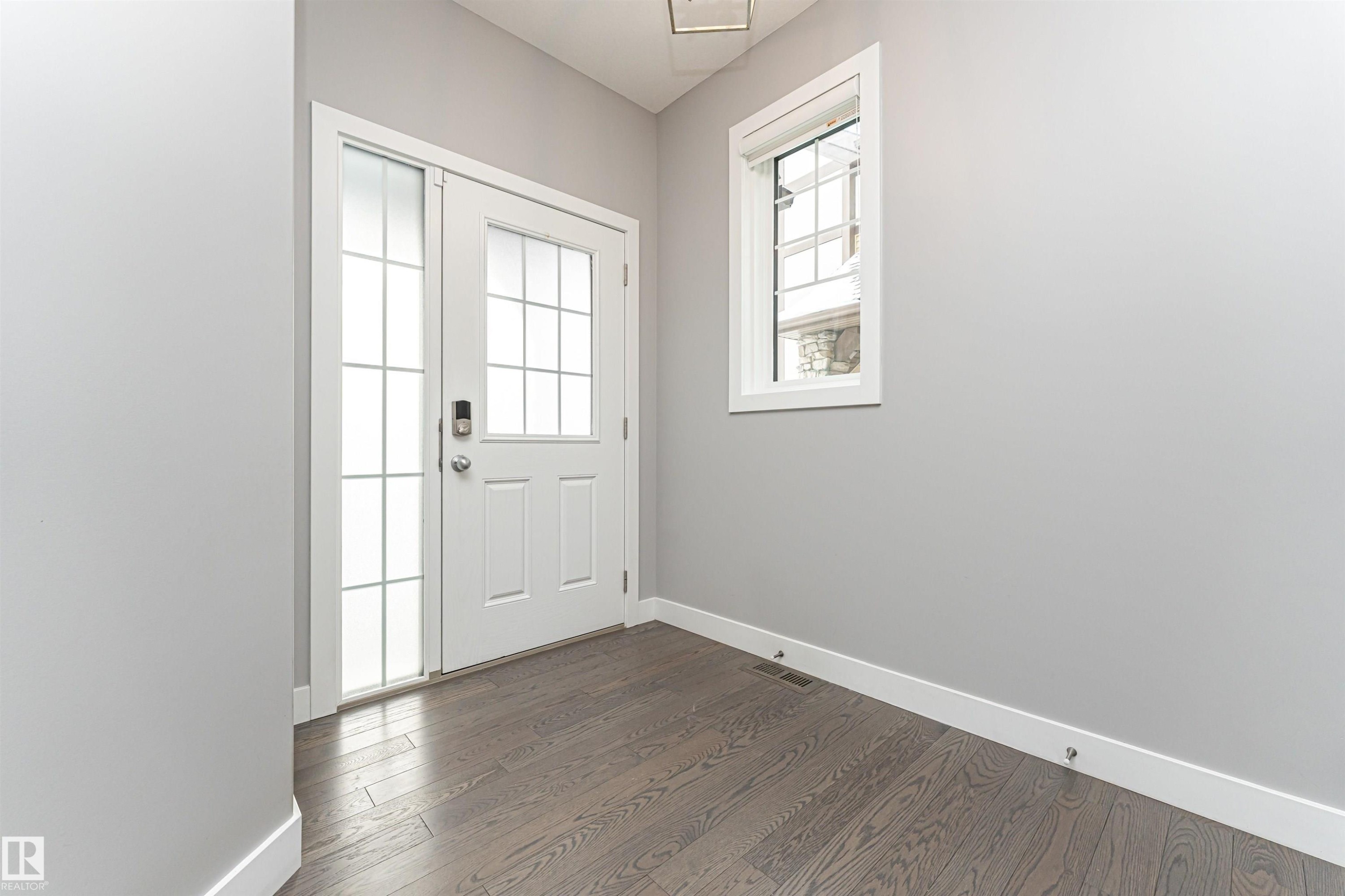 Doorway with wood finished floors - 3611 Keswick Boulevard, Edmonton, AB - Indoor Photo Showing Other Room