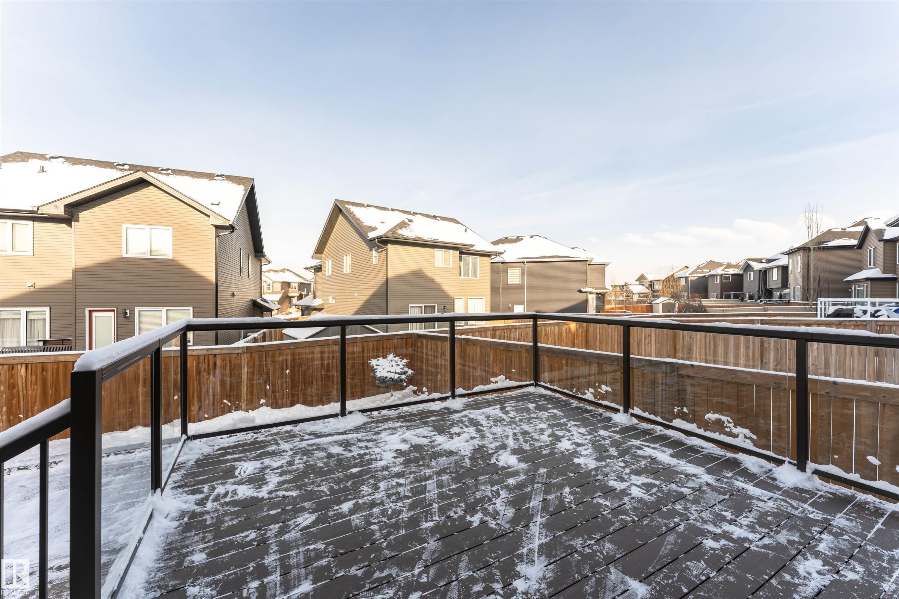 Snow covered deck with a residential view - 3611 Keswick Boulevard, Edmonton, AB - Outdoor