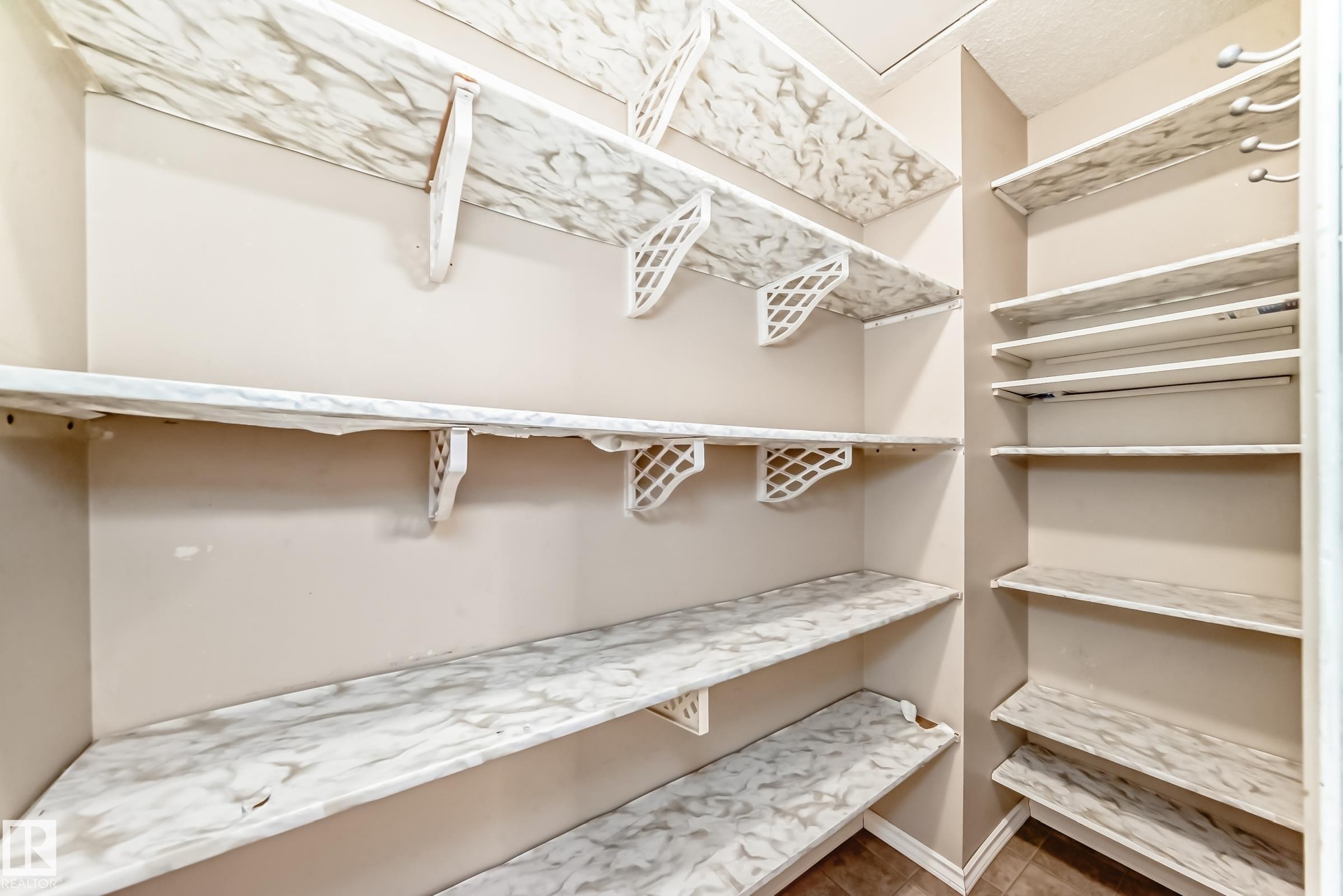 View of walk in closet - 5308 20 Avenue, Edmonton, AB - Indoor With Storage