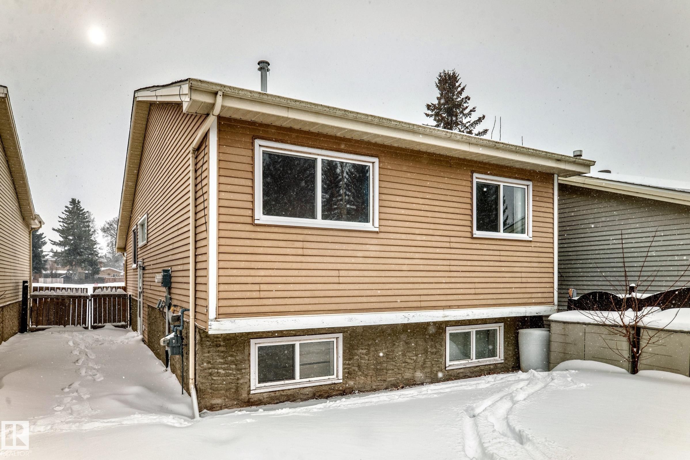 View of snow covered exterior - 5308 20 Avenue, Edmonton, AB - Outdoor With Exterior
