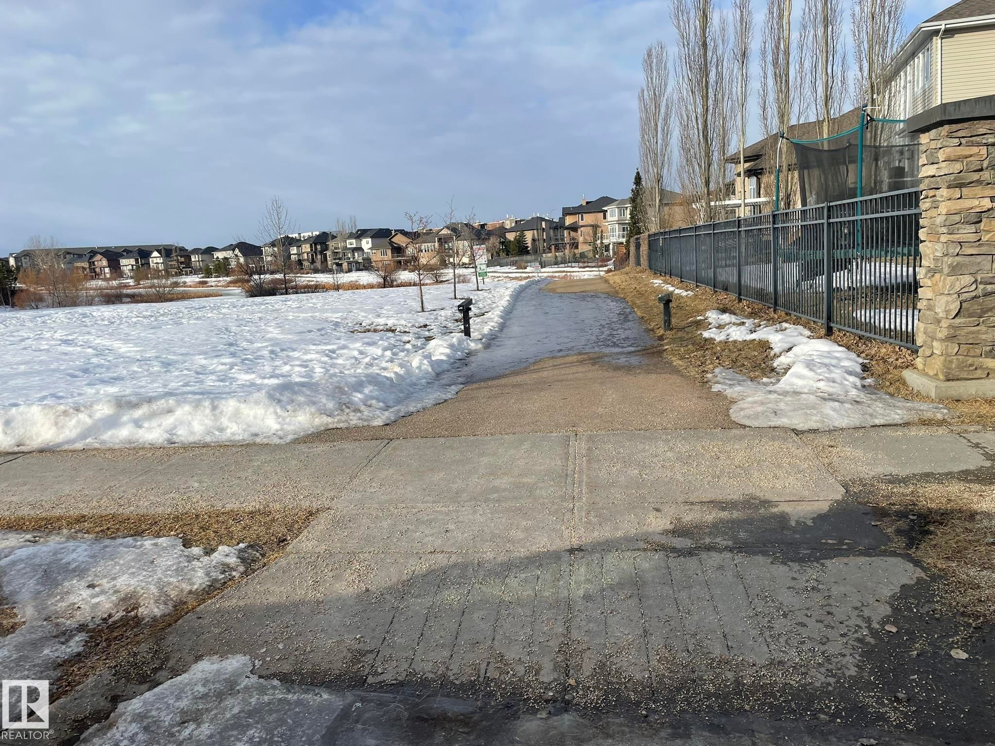 Snowy yard featuring a residential view - 169 Callaghan Drive, Edmonton, AB - Outdoor