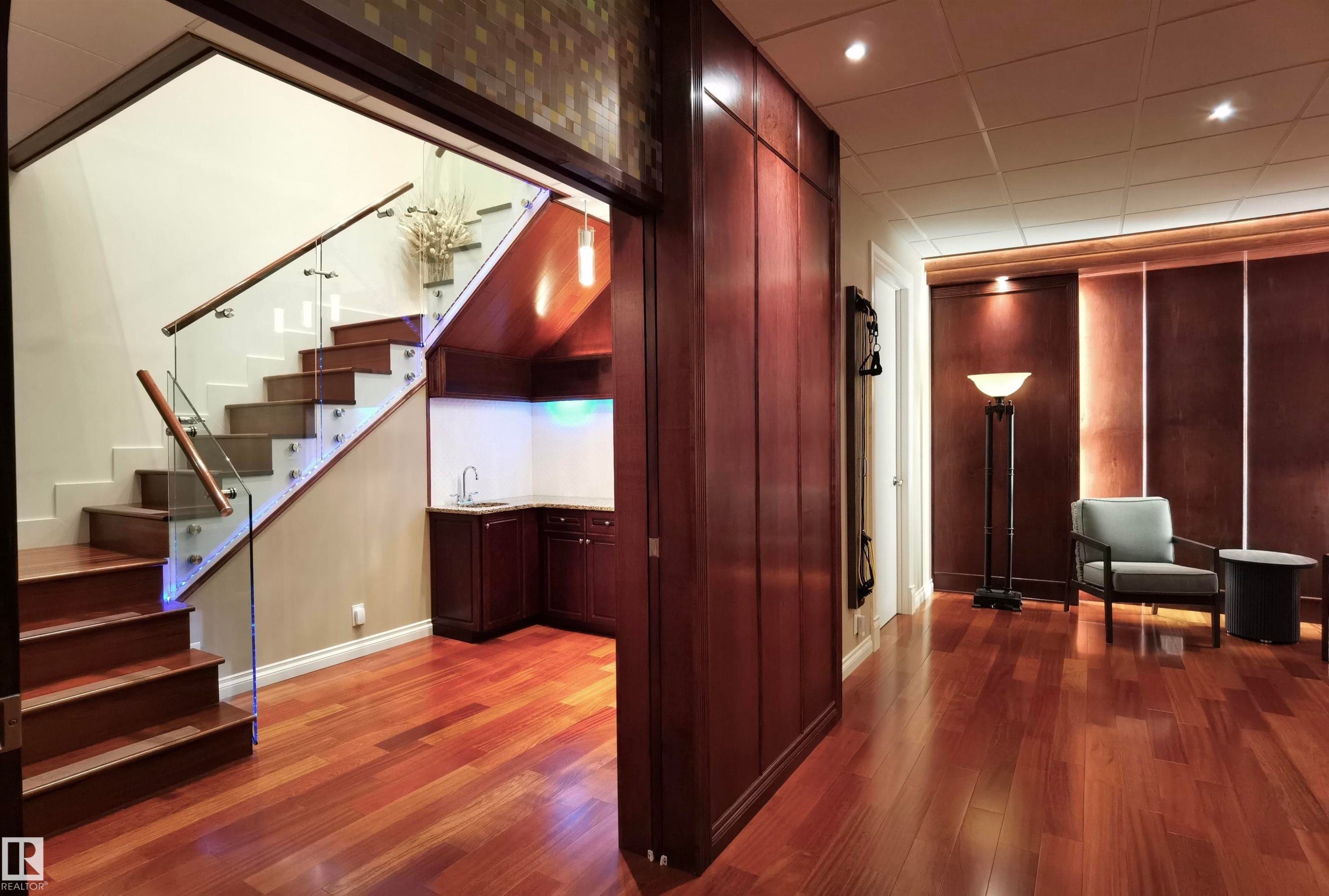 Stairway with wood finished floors and recessed lighting - 169 Callaghan Drive, Edmonton, AB - Indoor Photo Showing Other Room