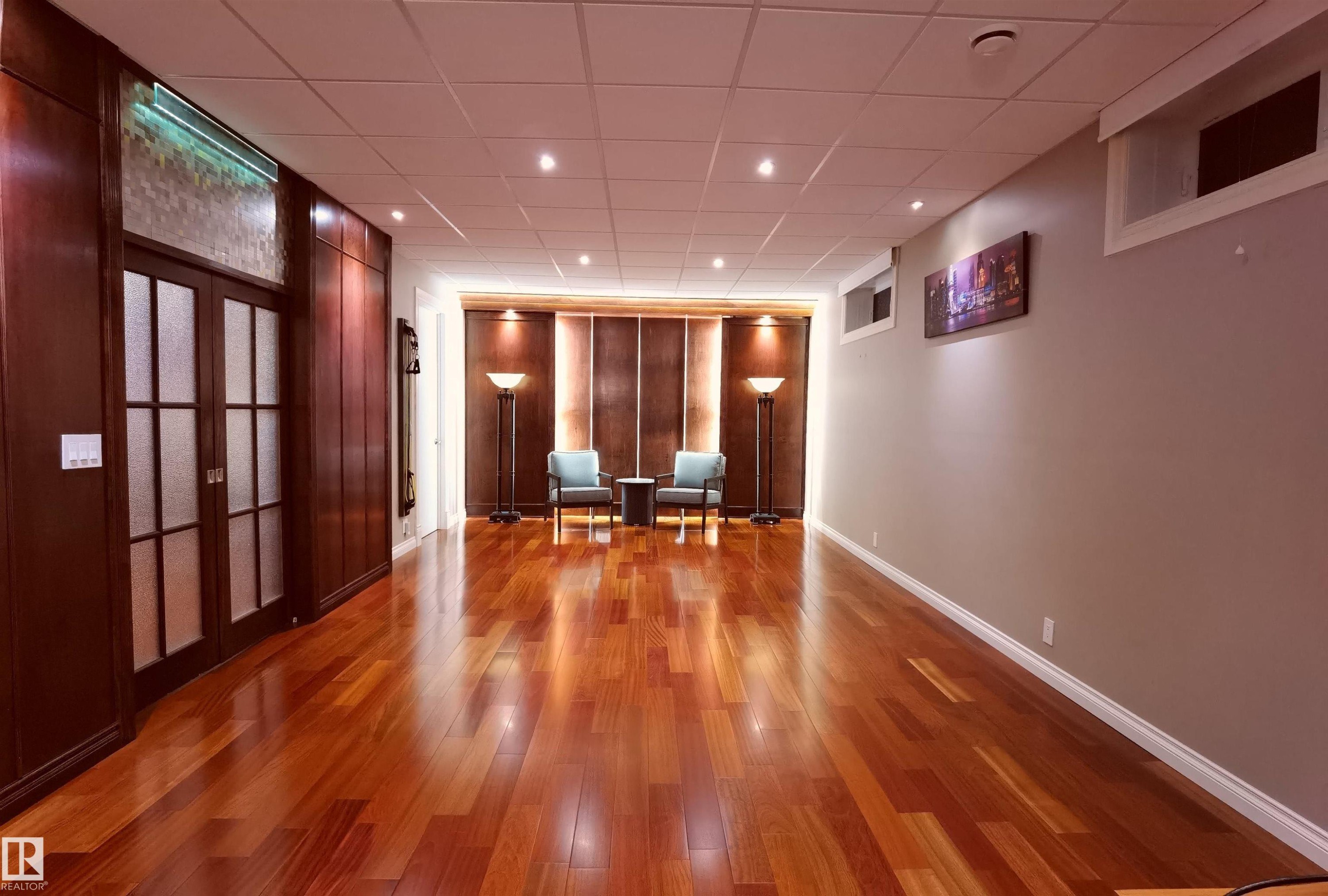 Interior space featuring a drop ceiling, wood finished floors, and recessed lighting - 169 Callaghan Drive, Edmonton, AB - Indoor Photo Showing Other Room