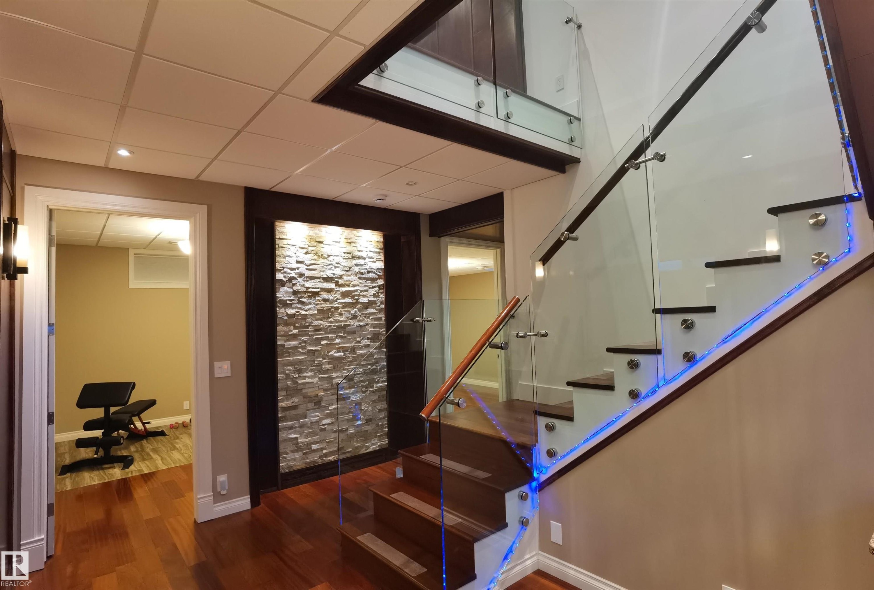Stairs featuring wood finished floors and a paneled ceiling - 169 Callaghan Drive, Edmonton, AB - Indoor Photo Showing Other Room