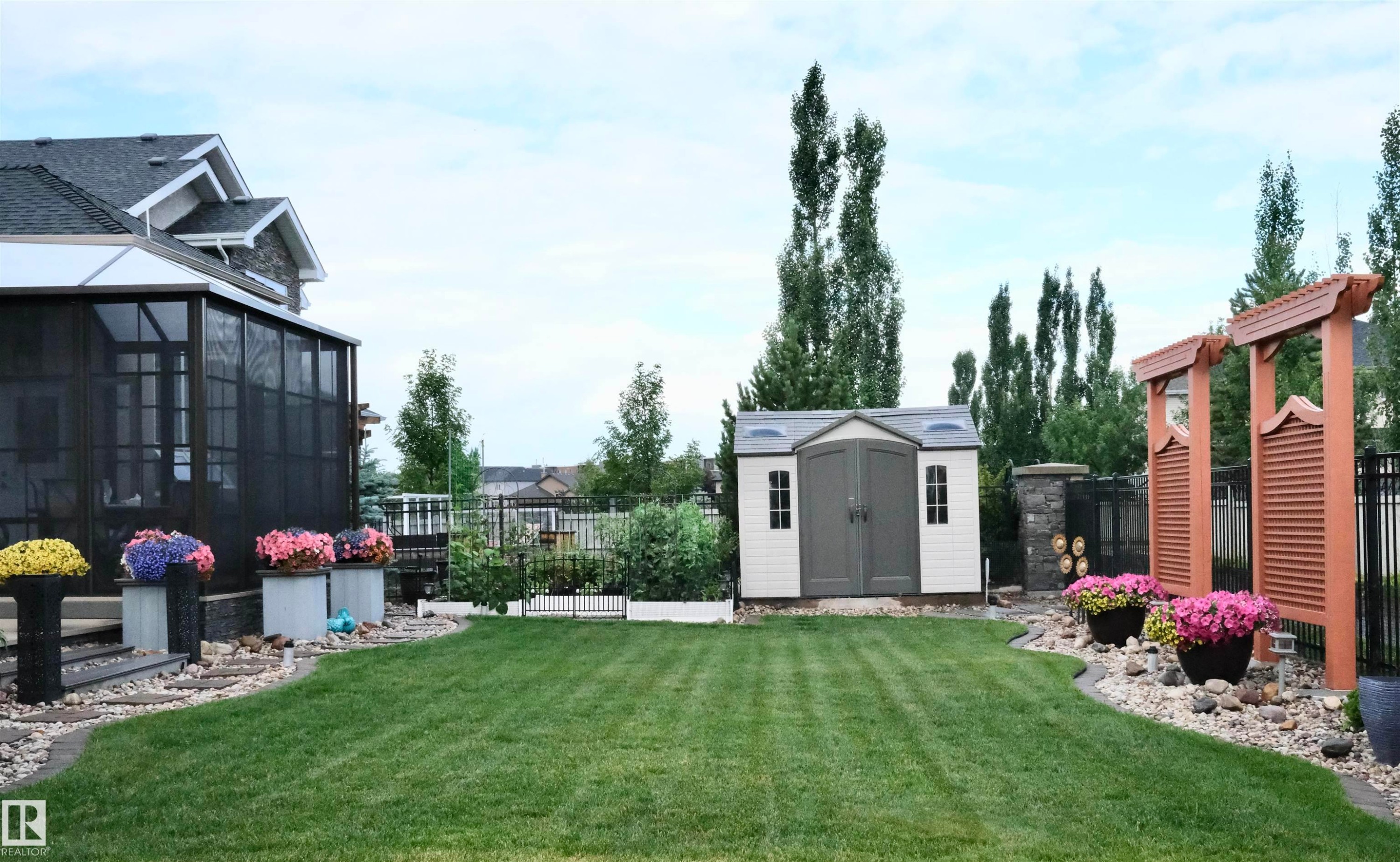 Fenced yard with a shed and a sunroom - 169 Callaghan Drive, Edmonton, AB - Outdoor