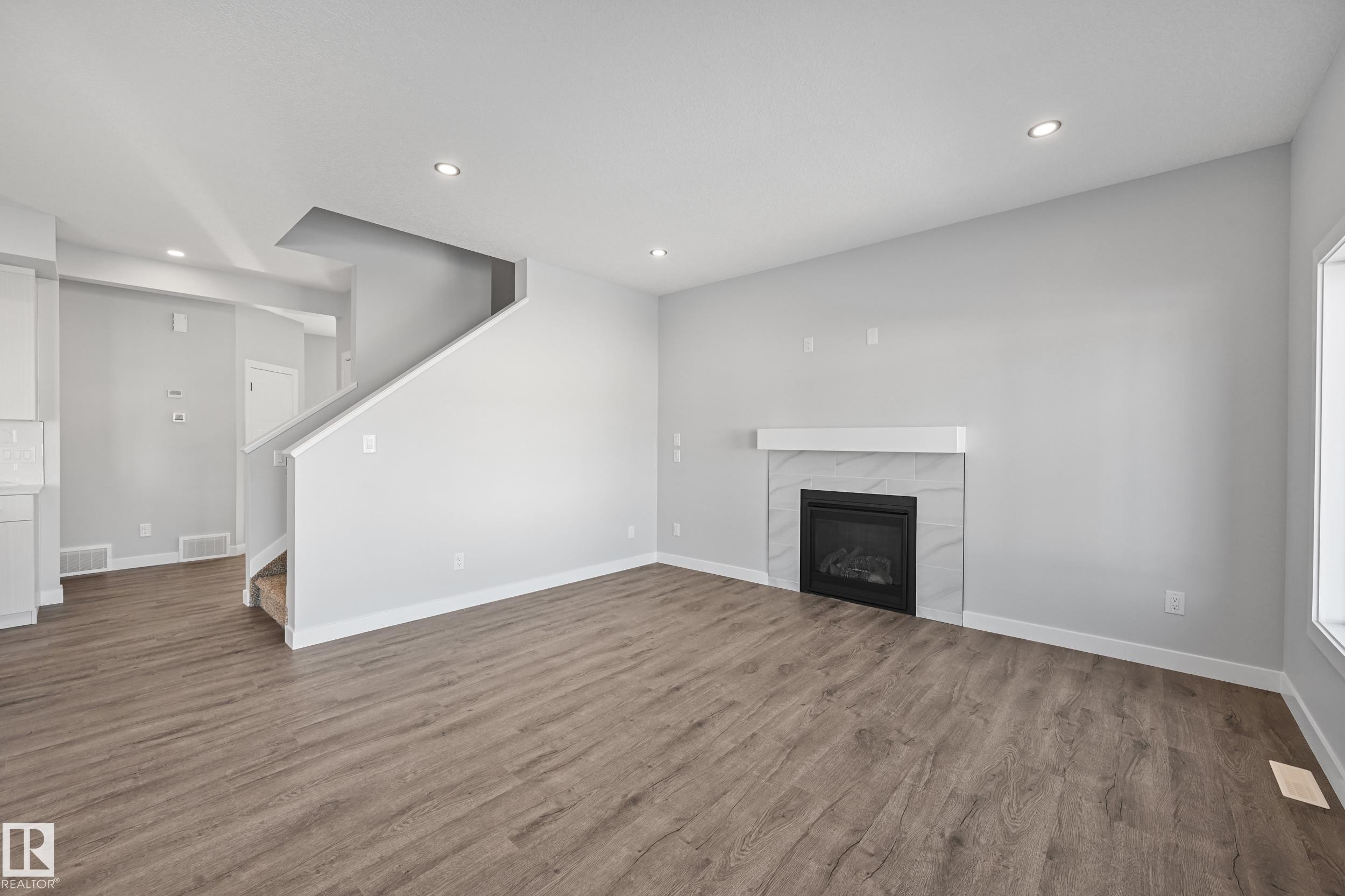 76 Maple Crescent, Gibbons, AB - Indoor Photo Showing Other Room With Fireplace