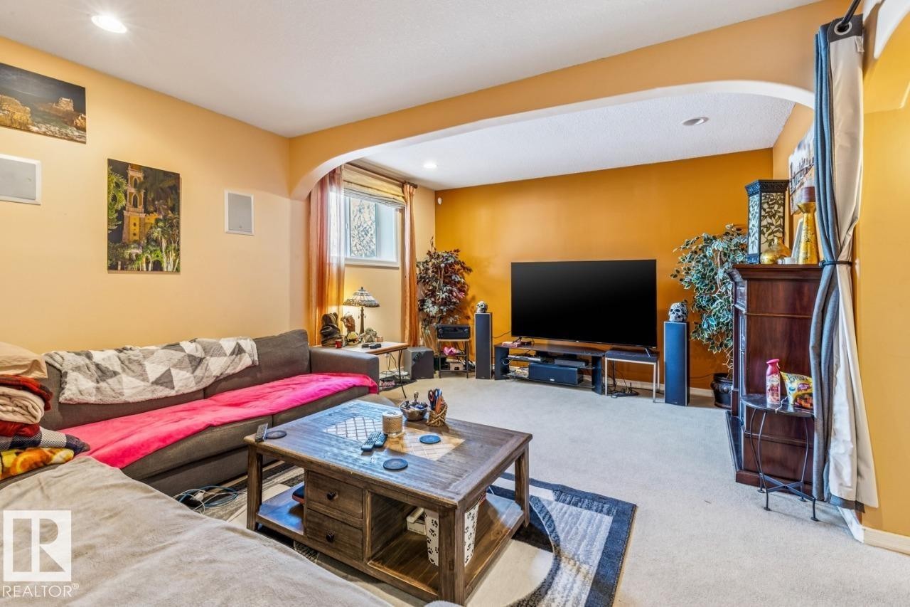 Large TV room with built in speakers in finished basement - 38 3003 34 Avenue, Edmonton, AB - Indoor Photo Showing Living Room