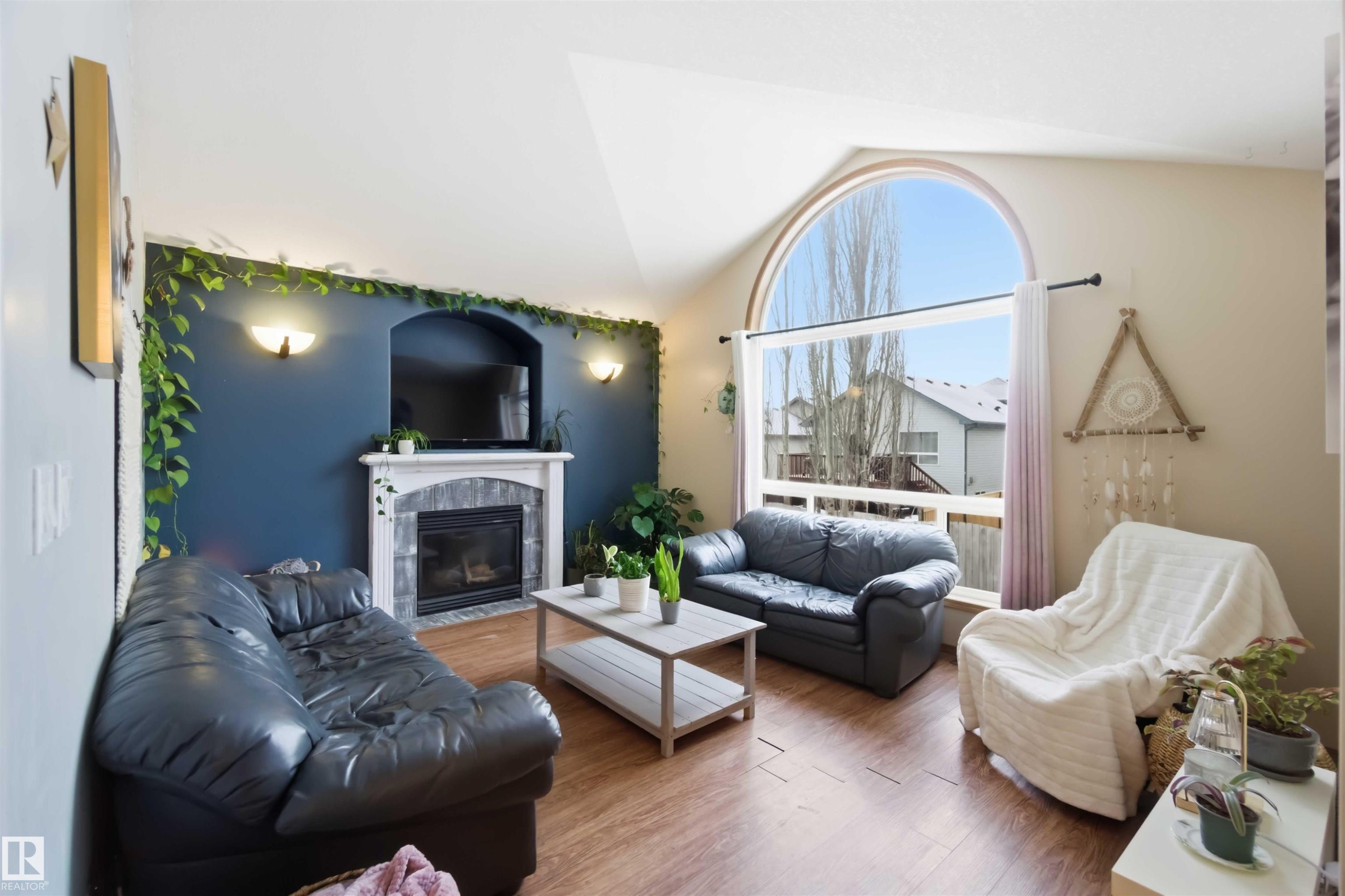 1304 Oakland Crescent, Devon, AB - Indoor Photo Showing Living Room With Fireplace
