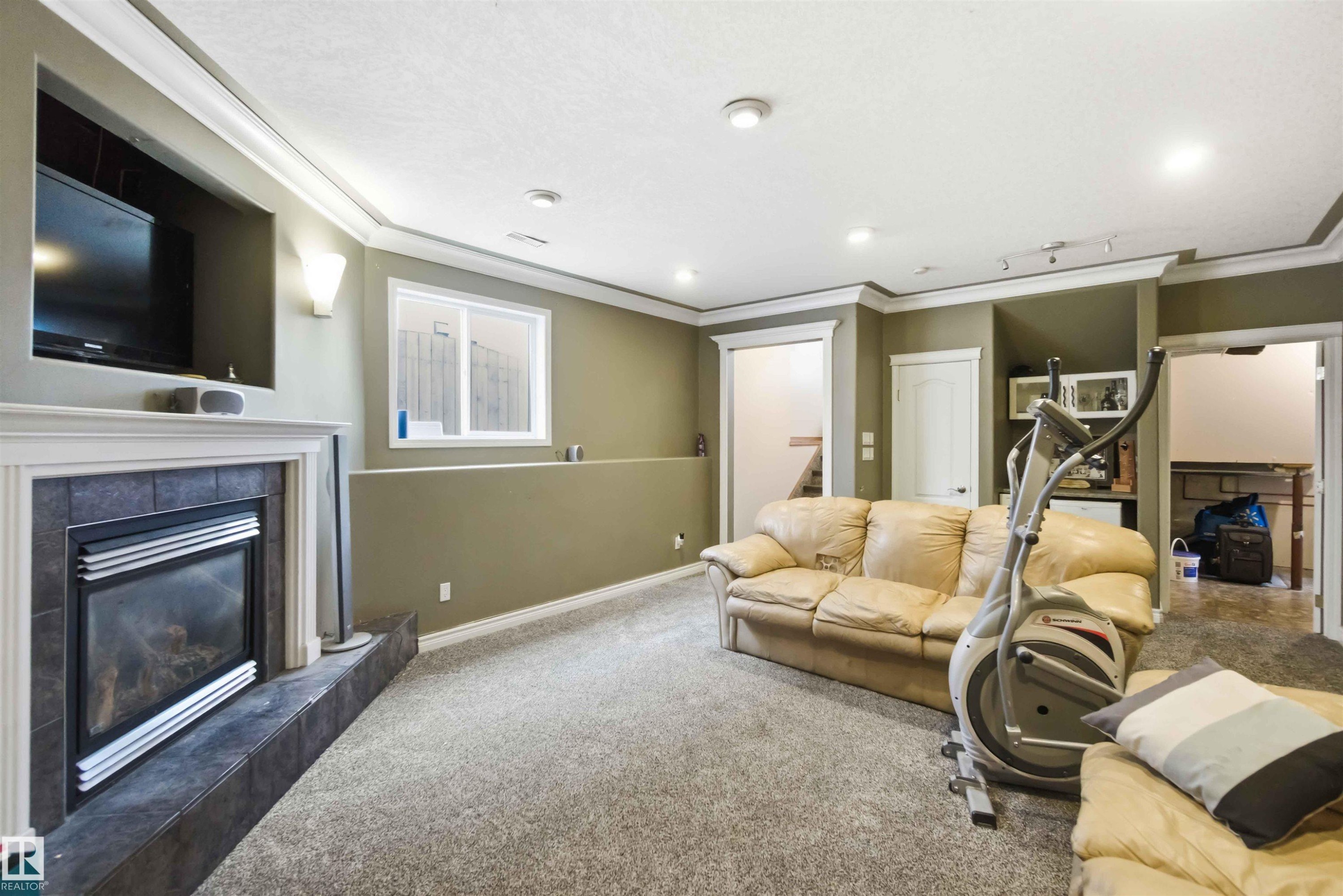 1304 Oakland Crescent, Devon, AB - Indoor Photo Showing Living Room With Fireplace