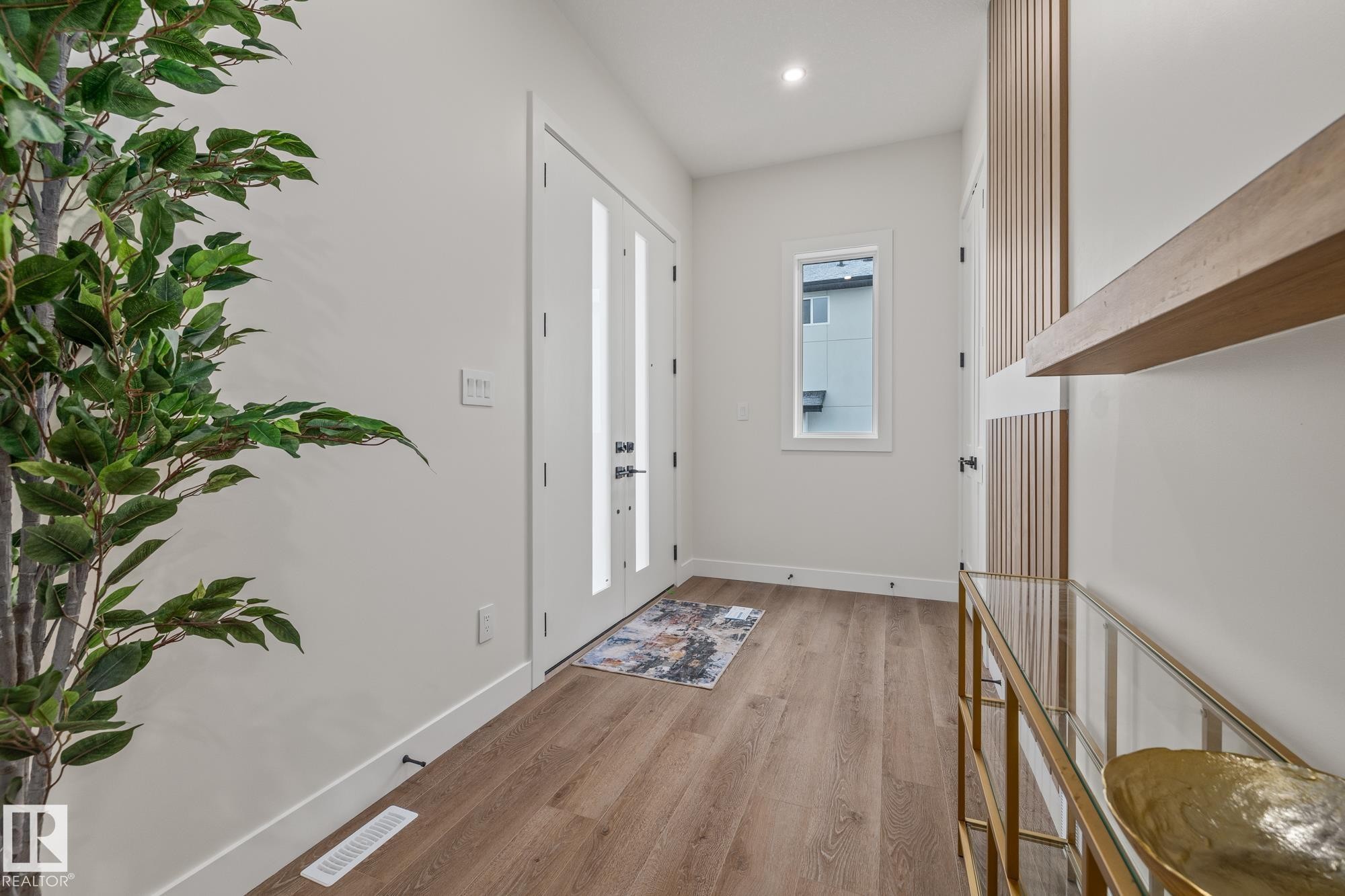 Entrance foyer featuring light wood-type flooring and recessed lighting - 132 Edgewater Circle, Leduc, AB - Indoor Photo Showing Other Room