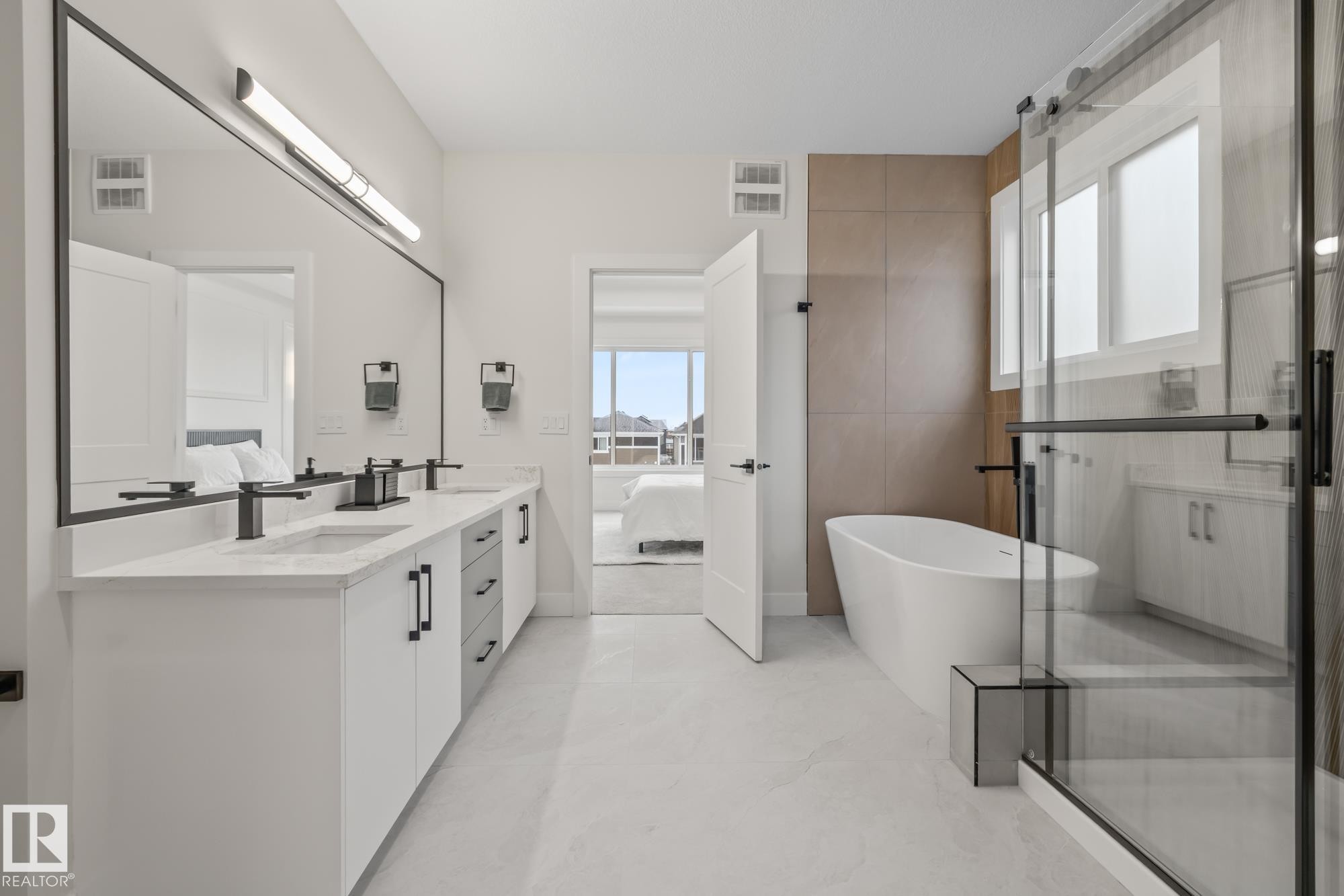 Full bath with ensuite bath, double vanity, a stall shower, and a freestanding tub - 132 Edgewater Circle, Leduc, AB - Indoor Photo Showing Bathroom