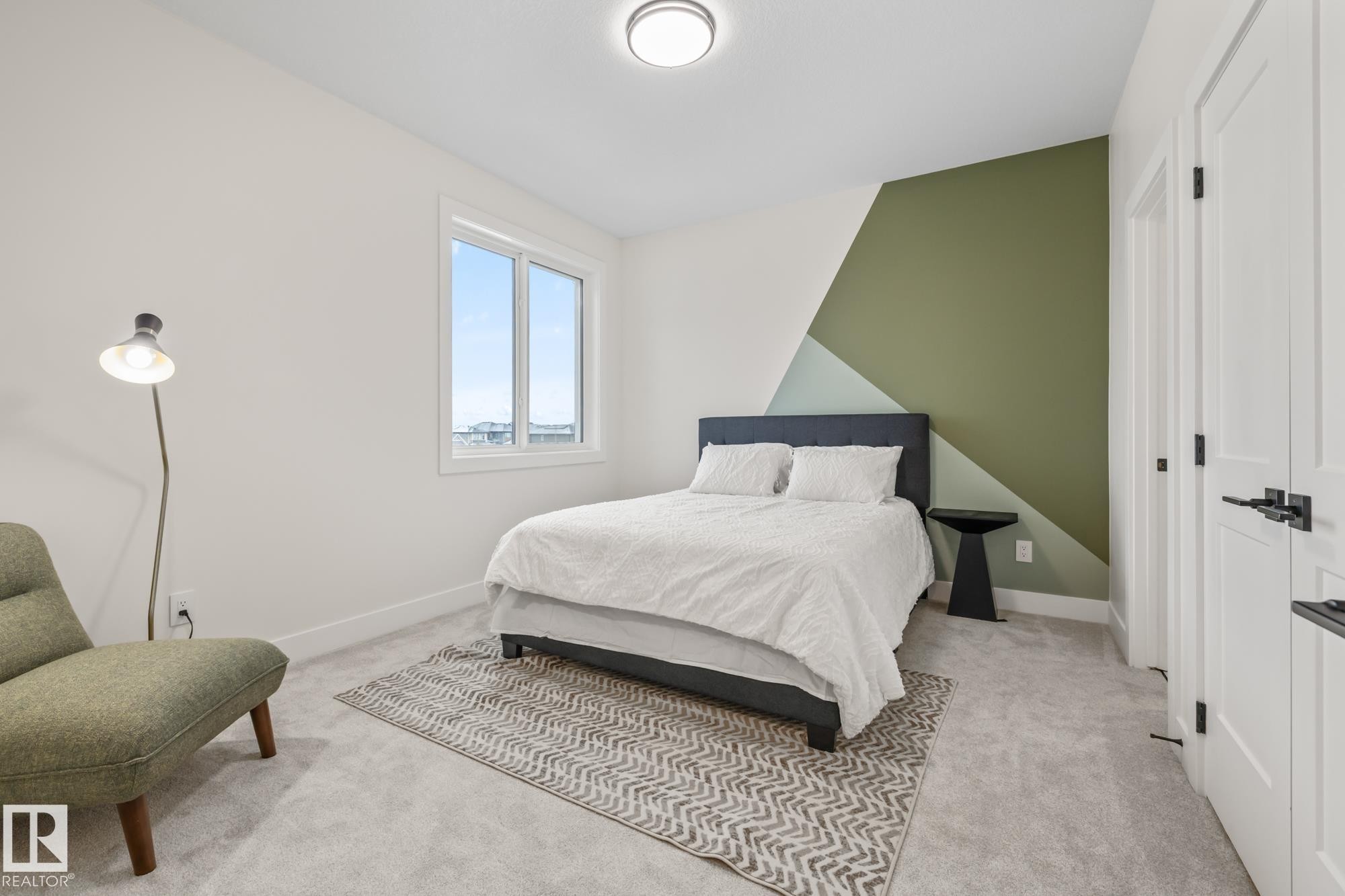 Bedroom with light colored carpet and a closet - 132 Edgewater Circle, Leduc, AB - Indoor Photo Showing Bedroom