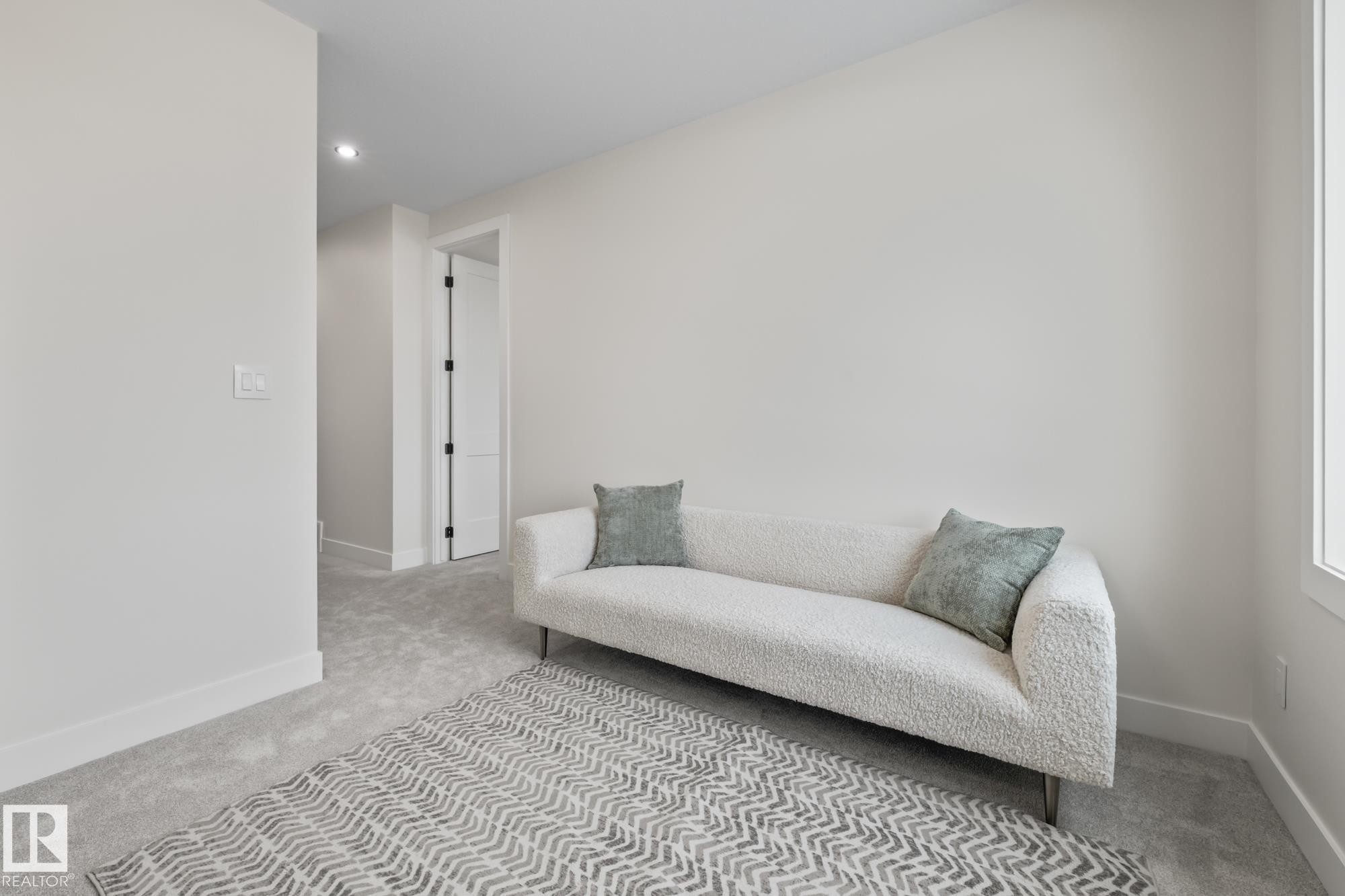 Sitting room featuring carpet and recessed lighting - 132 Edgewater Circle, Leduc, AB - Indoor