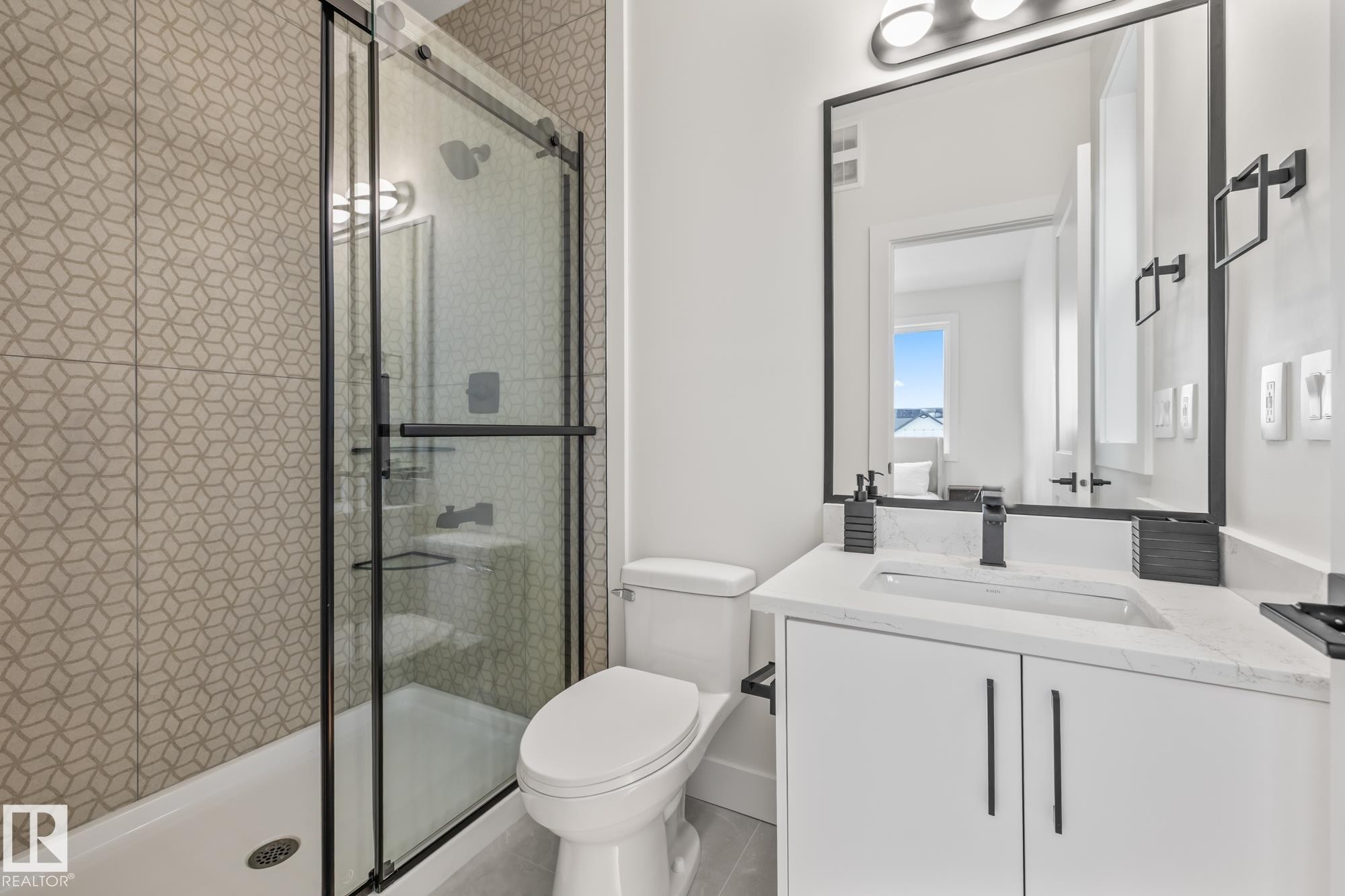 Bathroom with a stall shower, vanity, and tile patterned flooring - 132 Edgewater Circle, Leduc, AB - Indoor Photo Showing Bathroom