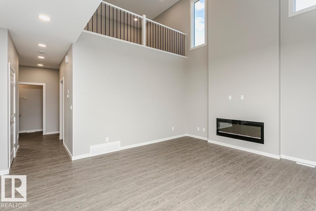 48 Gambel Loop, Spruce Grove, AB - Indoor Photo Showing Other Room With Fireplace