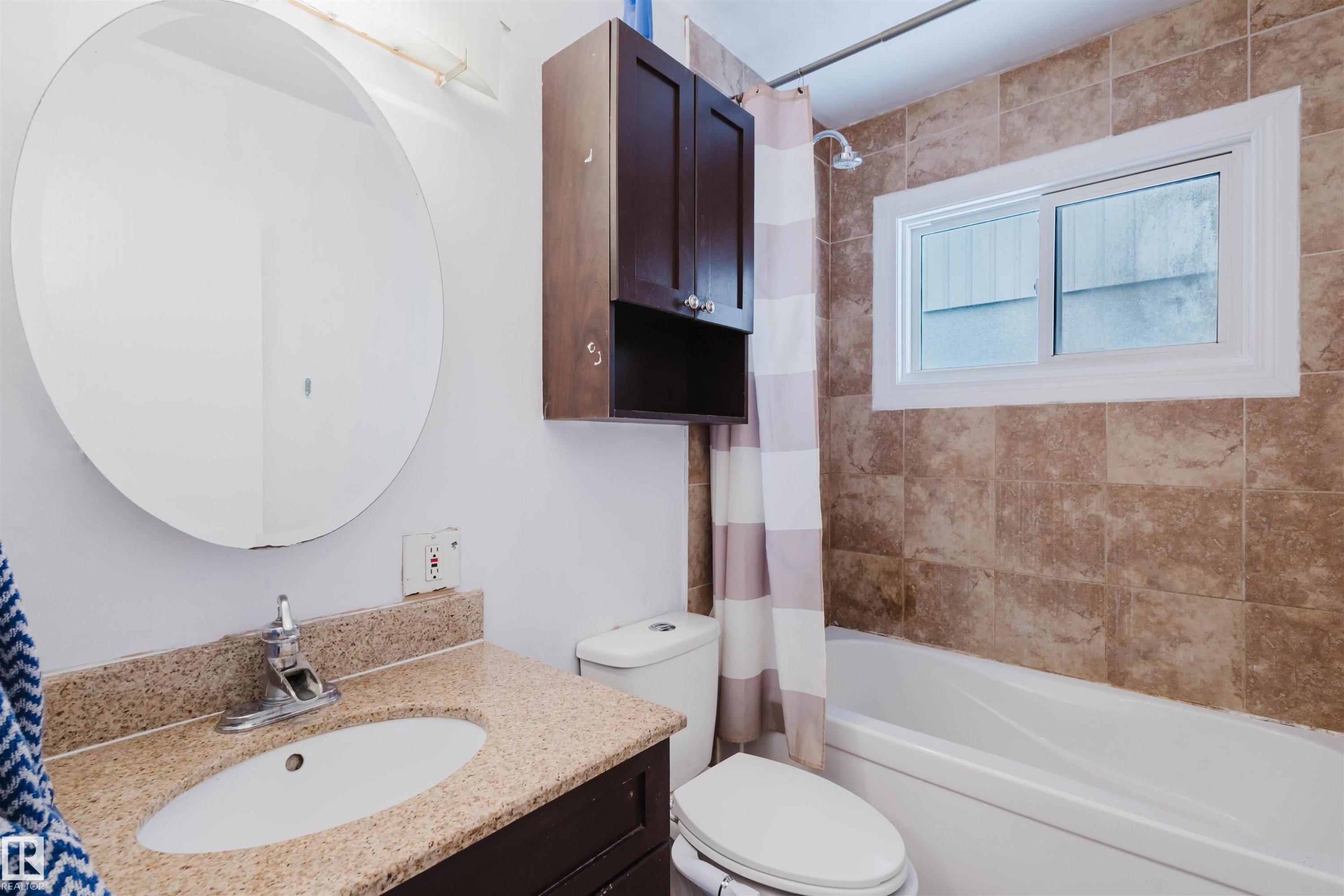 Bathroom featuring vanity and shower / tub combo - 6048 105B Street Nw, Edmonton, AB - Indoor Photo Showing Bathroom
