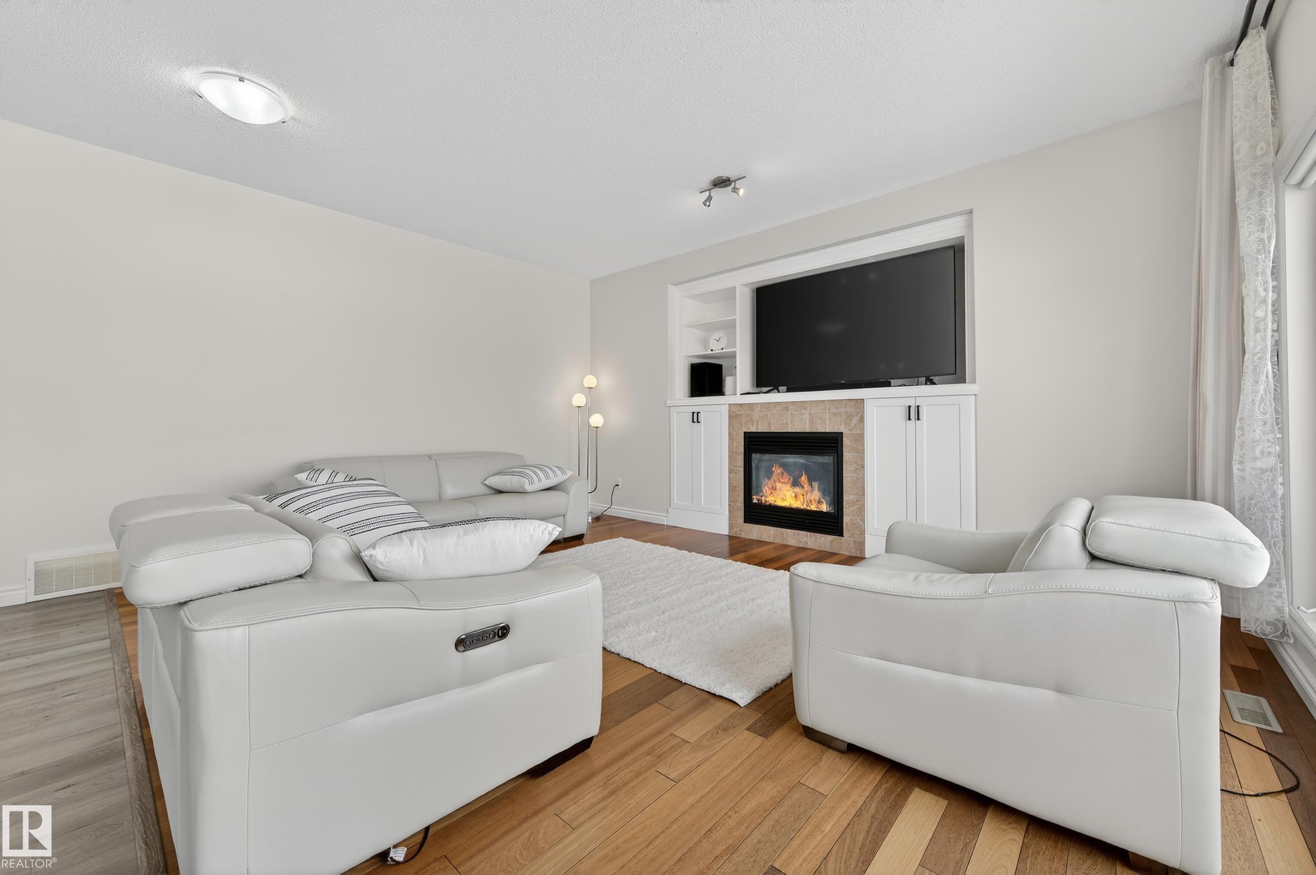 7507 Speaker Way, Edmonton, AB - Indoor Photo Showing Living Room With Fireplace